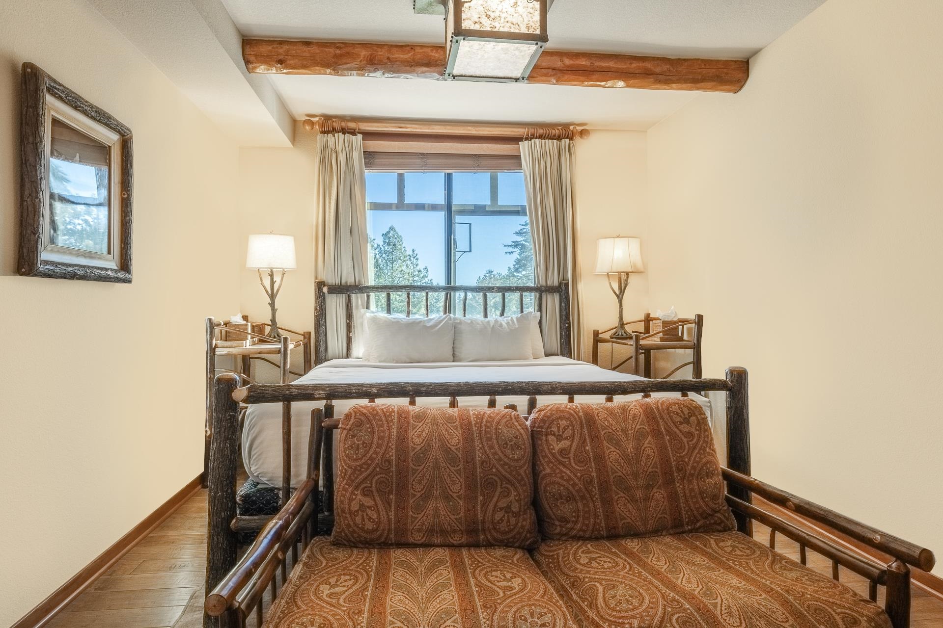 6201 Minaret Road, Unit 2317 Mammoth Lakes, CA 93546 - Photo 31 of 44 a bed sitting in a bedroom next to a window