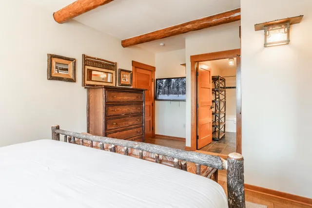 a bed room with a bed and a window