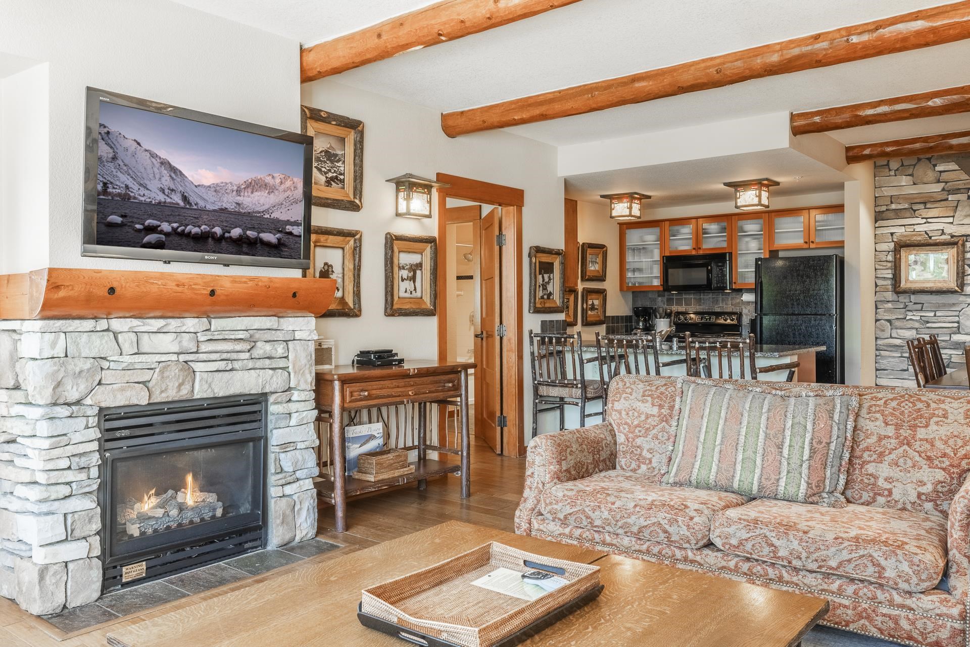6201 Minaret Road, Unit 2317 Mammoth Lakes, CA 93546 - Photo 5 of 44 a living room with furniture and a fireplace
