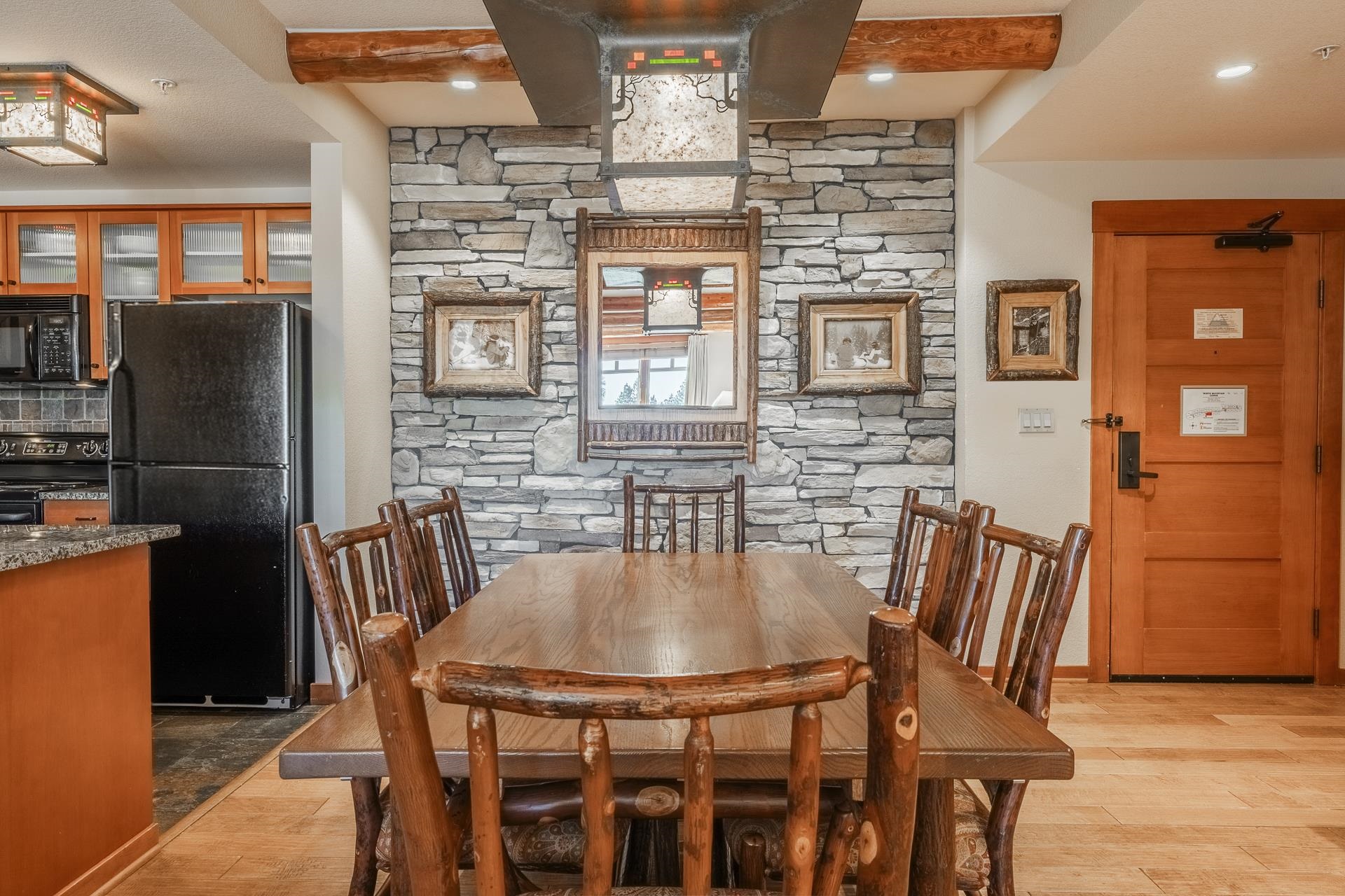 6201 Minaret Road, Unit 2317 Mammoth Lakes, CA 93546 - Photo 8 of 44 a dining room with furniture and window