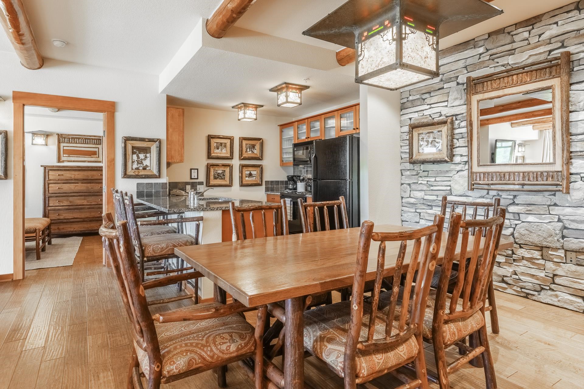 6201 Minaret Road, Unit 2317 Mammoth Lakes, CA 93546 - Photo 10 of 44 a view of a dining room with furniture window and wooden floor