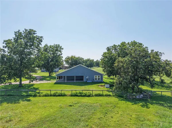 a view of a house with a big yard