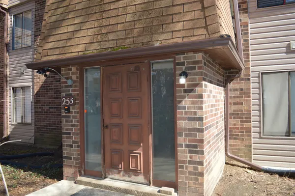 a front view of a building with a shower and a window