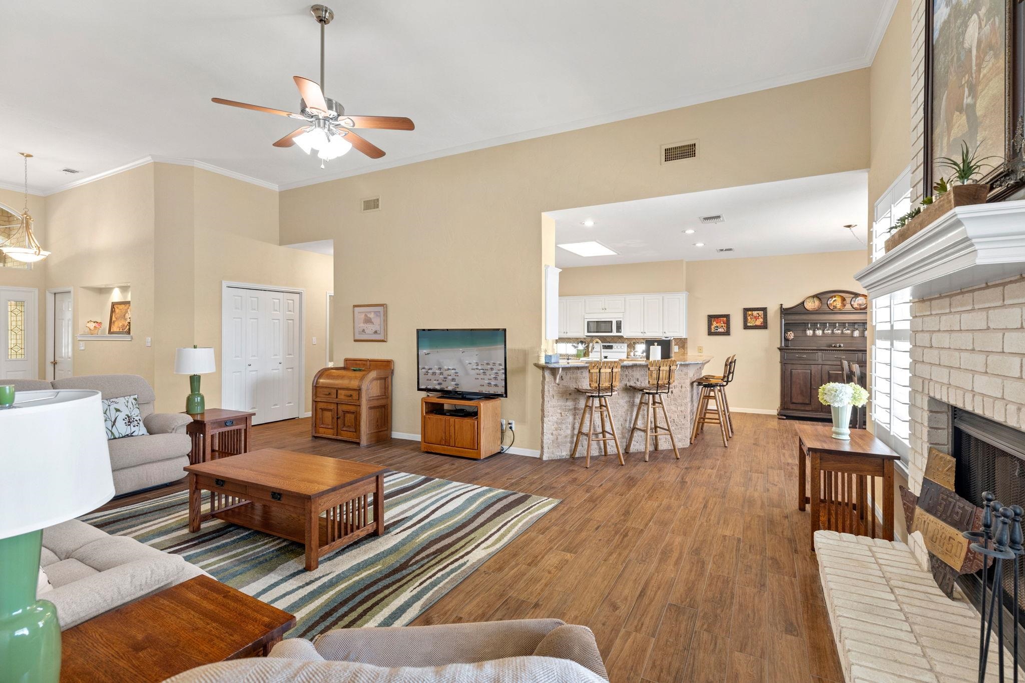 129 Web Isle Drive Granite Shoals, TX 78654 - Photo 12 of 30 a living room with fireplace furniture and a flat screen tv