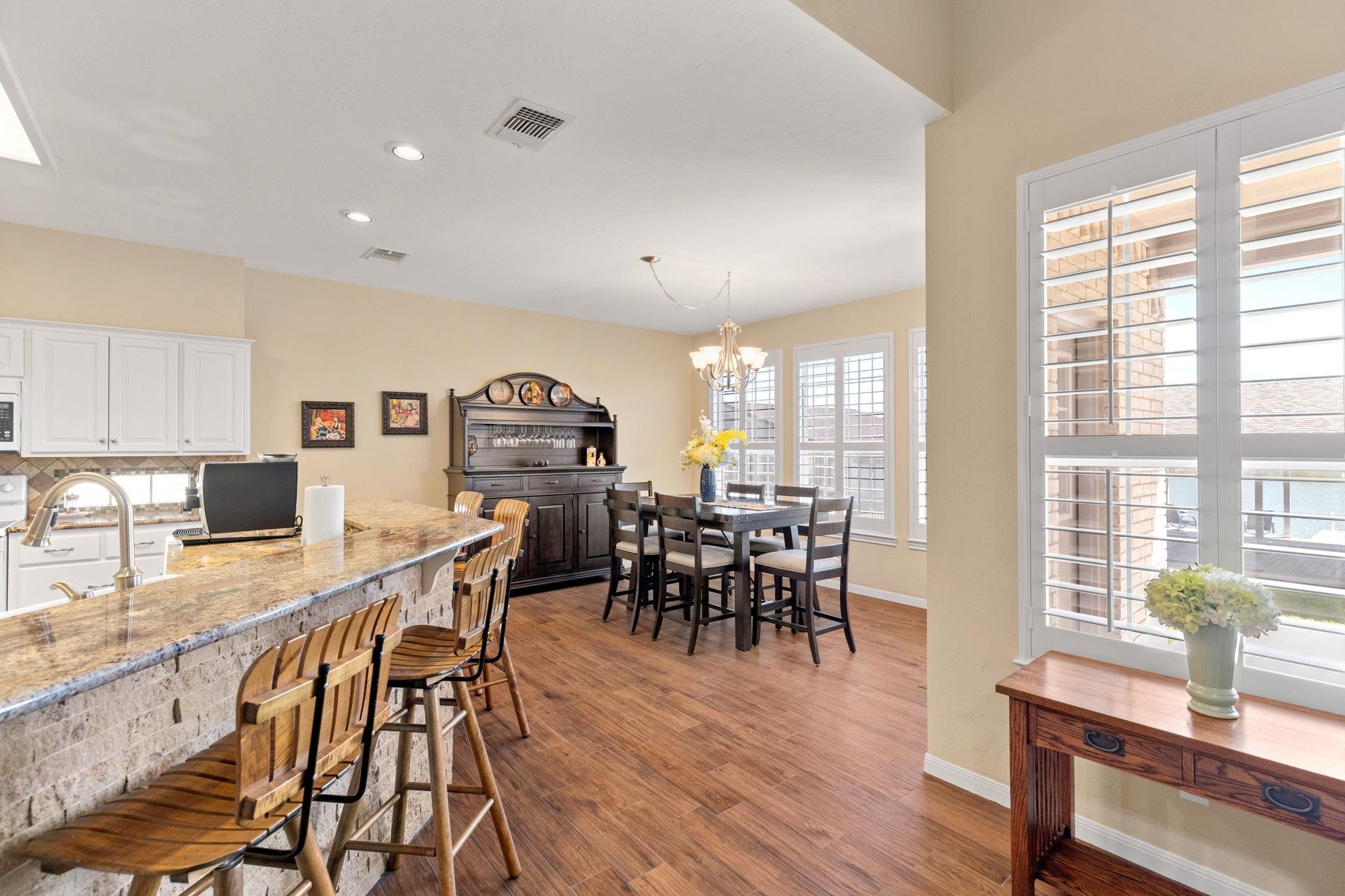 129 Web Isle Drive Granite Shoals, TX 78654 - Photo 13 of 30 a view of a dining room with furniture window and wooden floor