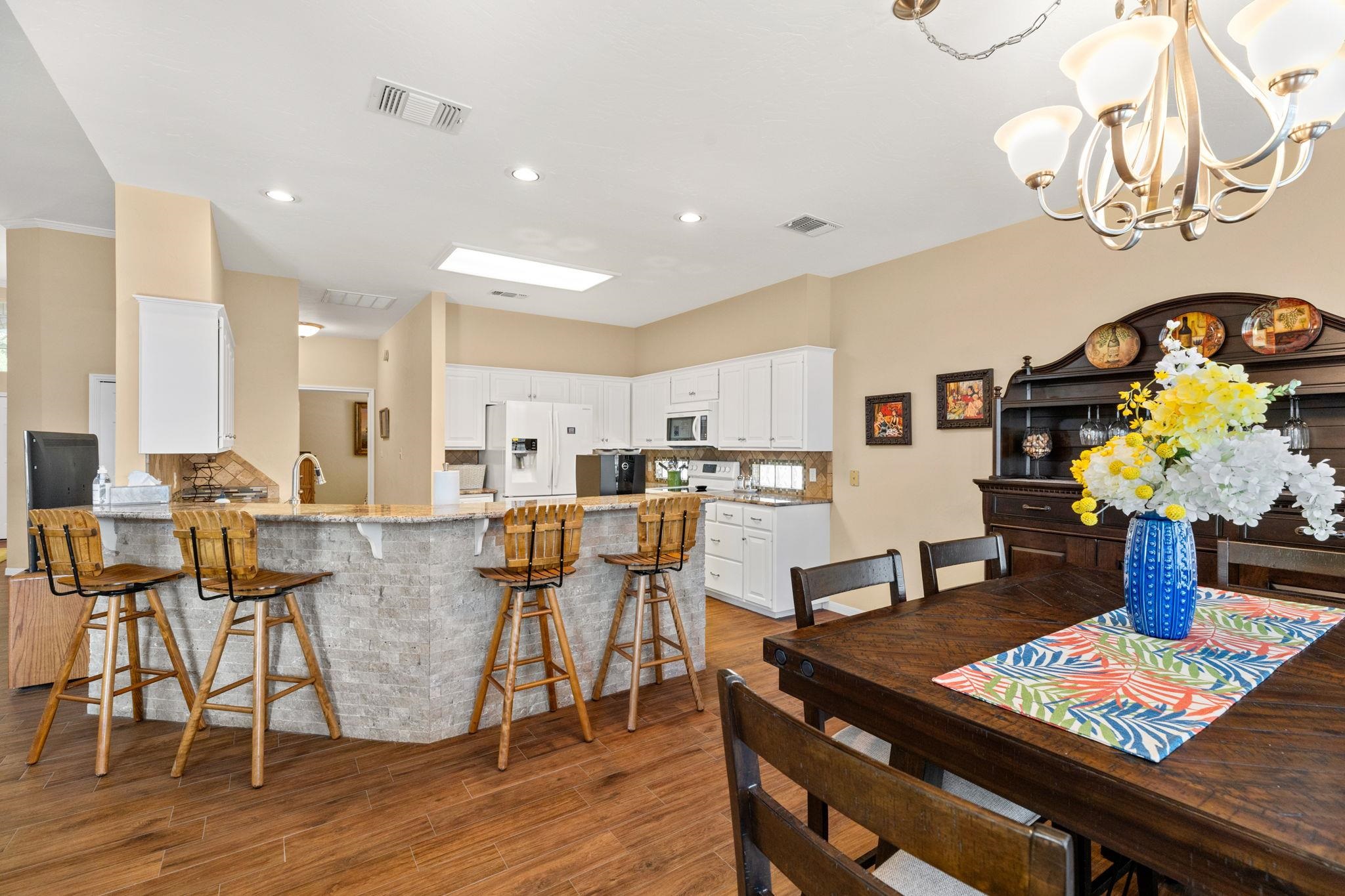 129 Web Isle Drive Granite Shoals, TX 78654 - Photo 14 of 30 a living room with dining room and wooden floor