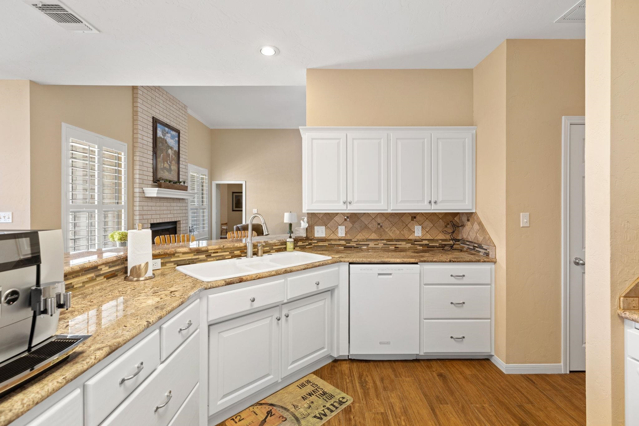 129 Web Isle Drive Granite Shoals, TX 78654 - Photo 16 of 30 a kitchen with a sink window and cabinets