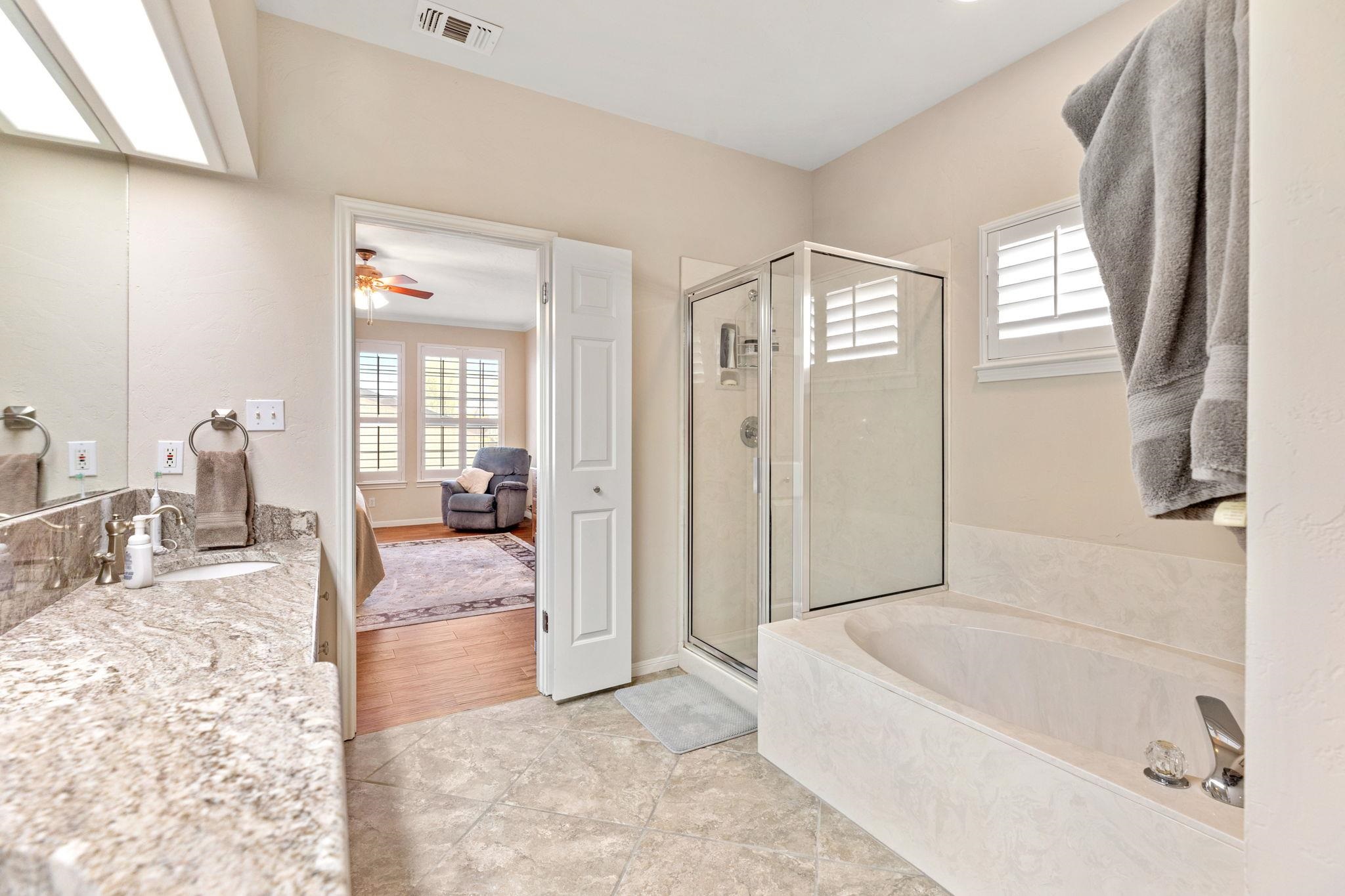 129 Web Isle Drive Granite Shoals, TX 78654 - Photo 21 of 30 a spacious bathroom with a tub shower and a sink