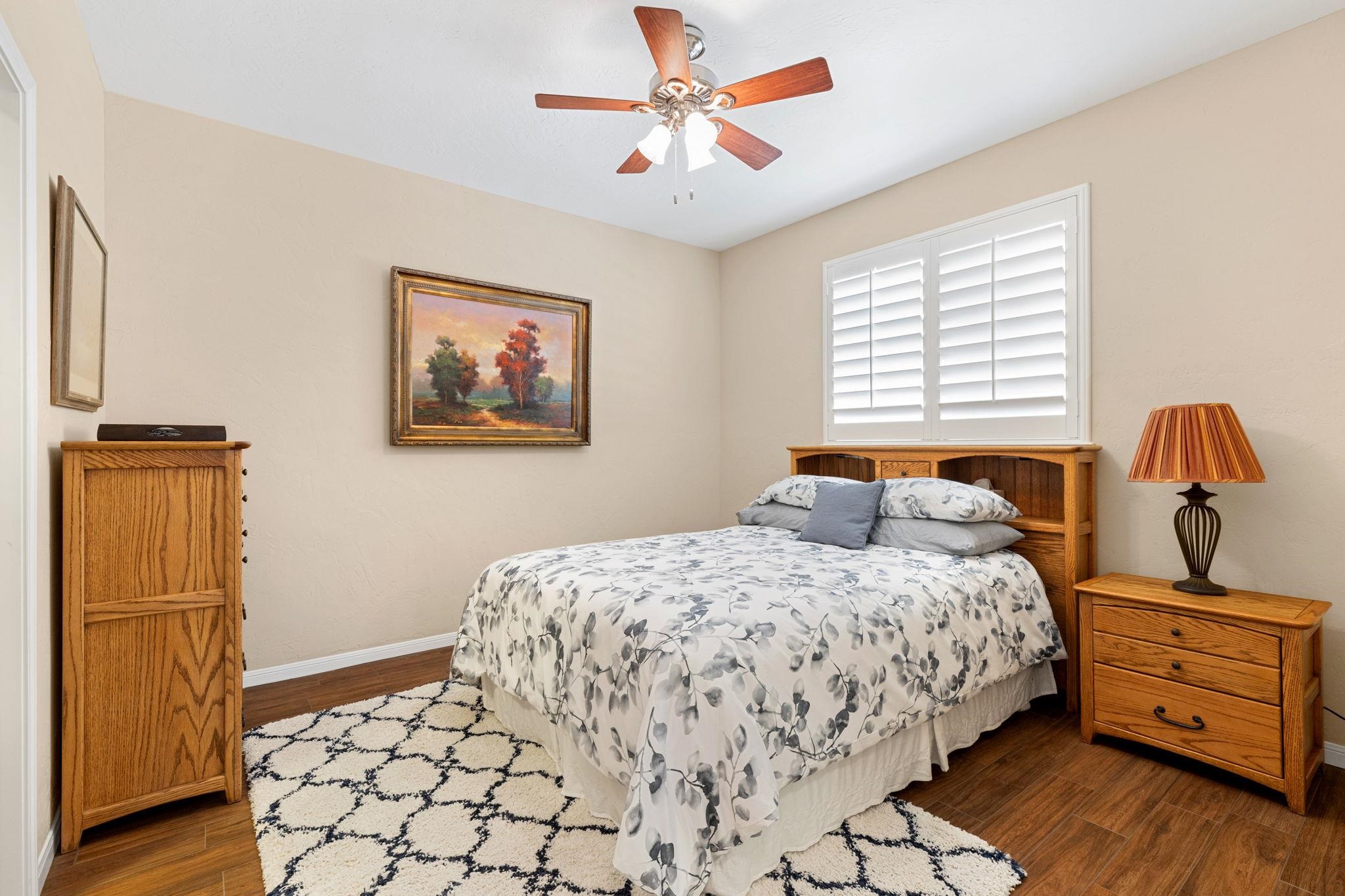 129 Web Isle Drive Granite Shoals, TX 78654 - Photo 22 of 30 a bedroom with a bed and wooden floor