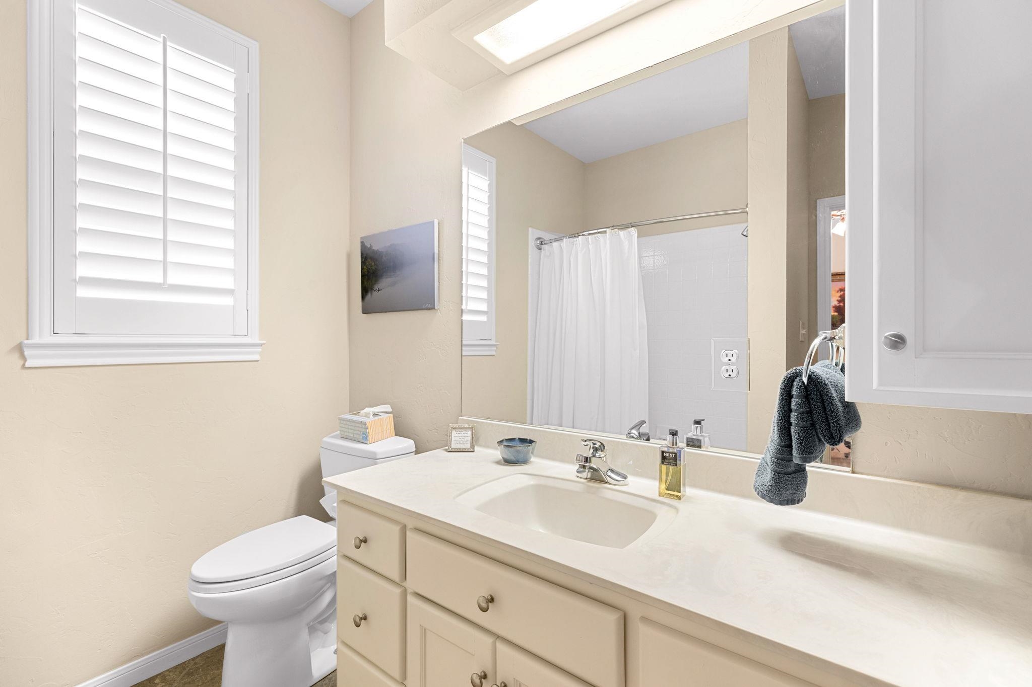 129 Web Isle Drive Granite Shoals, TX 78654 - Photo 23 of 30 a bathroom with a toilet sink and mirror