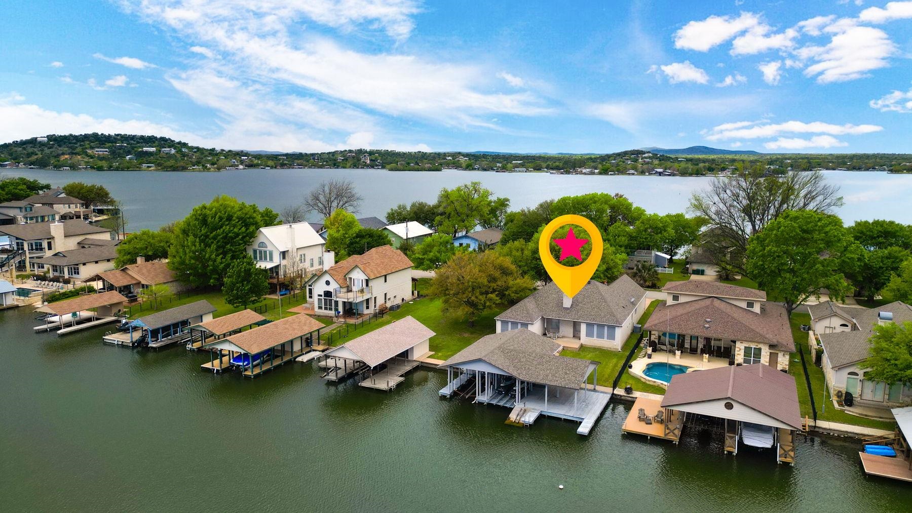 129 Web Isle Drive Granite Shoals, TX 78654 - Photo 3 of 30 an aerial view of a swimming pool with outdoor seating and lake view