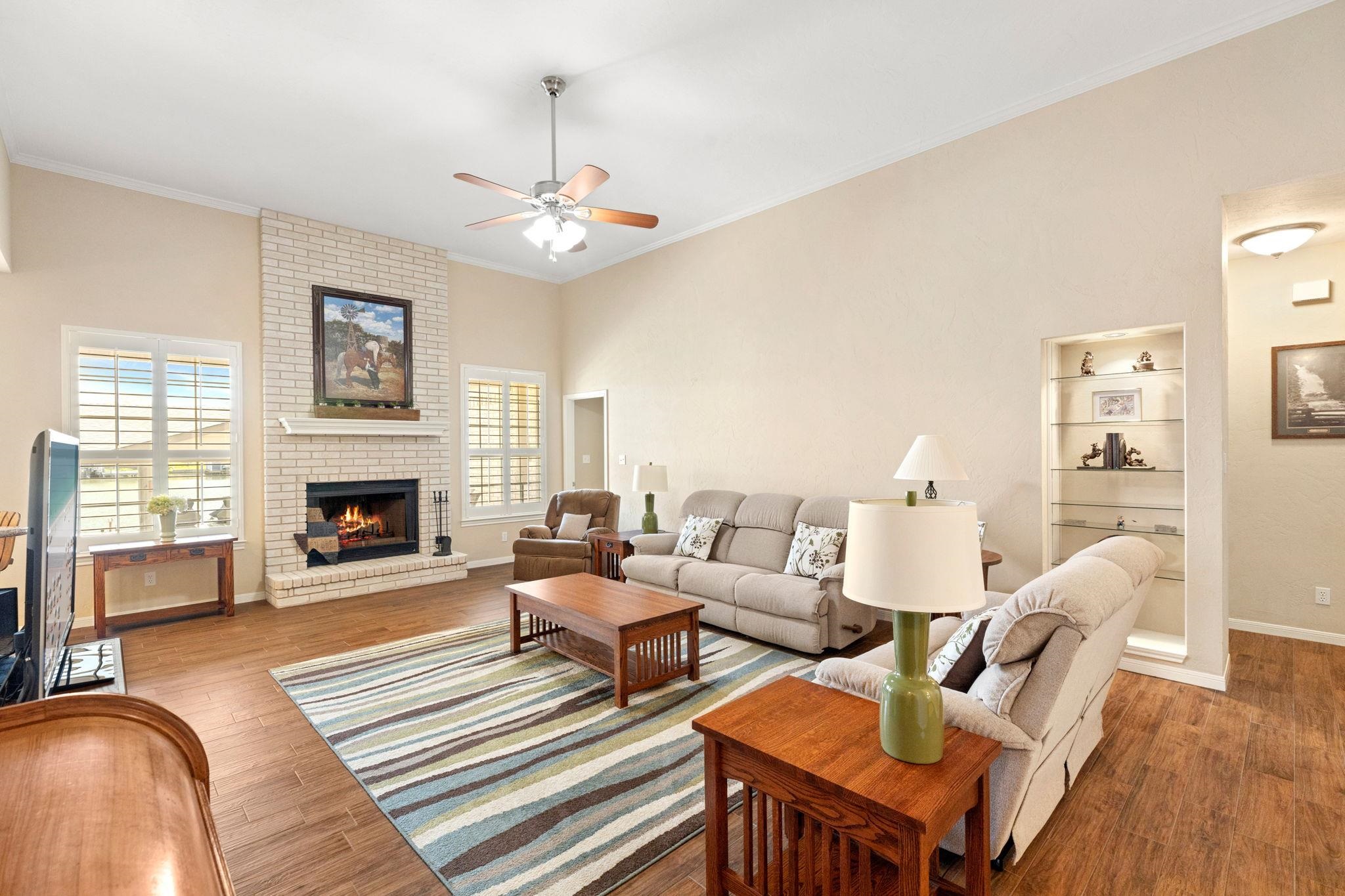 129 Web Isle Drive Granite Shoals, TX 78654 - Photo 9 of 30 a living room with fireplace furniture and a fireplace