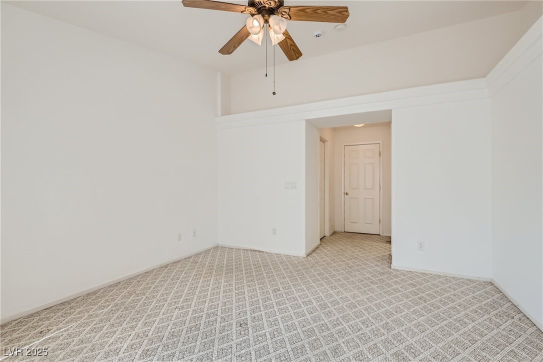 7550 Slipstream Street Las Vegas, NV 89139 - Photo 24 of 33 Unfurnished room with carpet and a ceiling fan