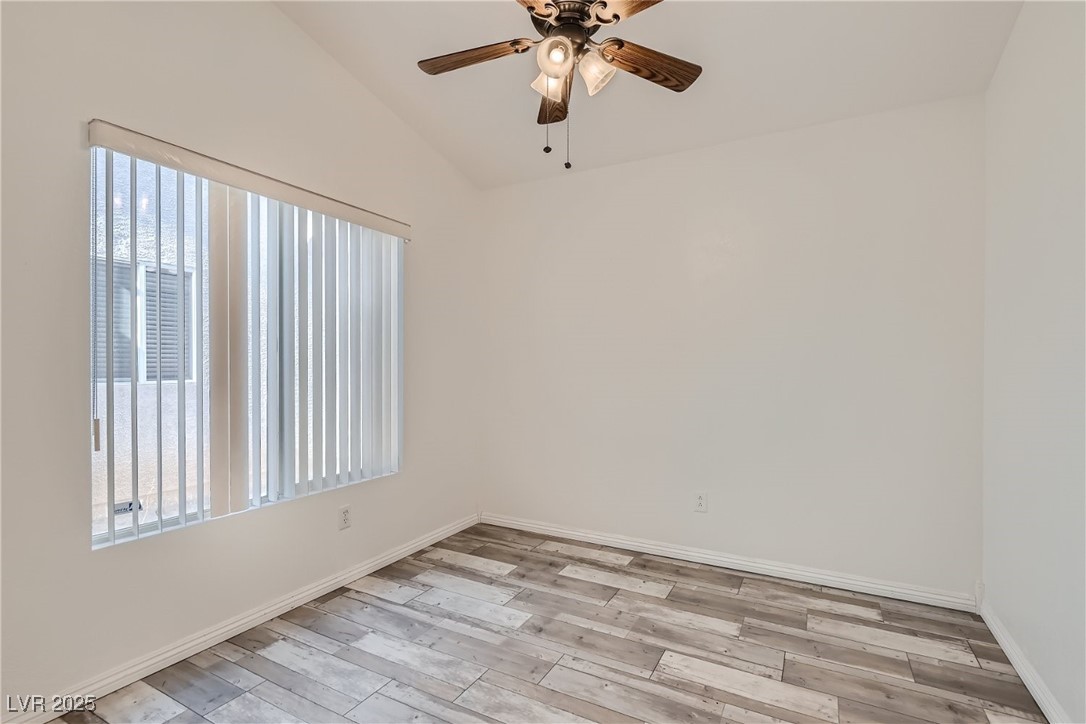 7550 Slipstream Street Las Vegas, NV 89139 - Photo 27 of 33 Unfurnished room featuring light wood finished floors and a ceiling fan