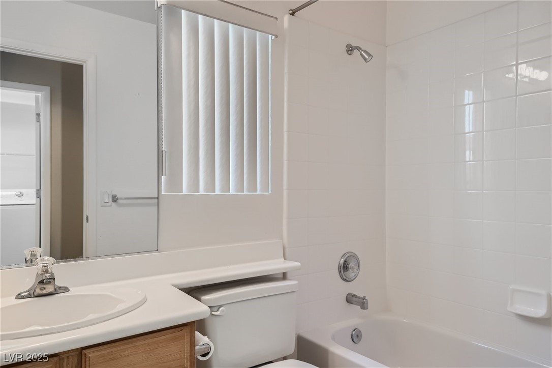 7550 Slipstream Street Las Vegas, NV 89139 - Photo 28 of 33 Bathroom featuring bathing tub / shower combination and vanity