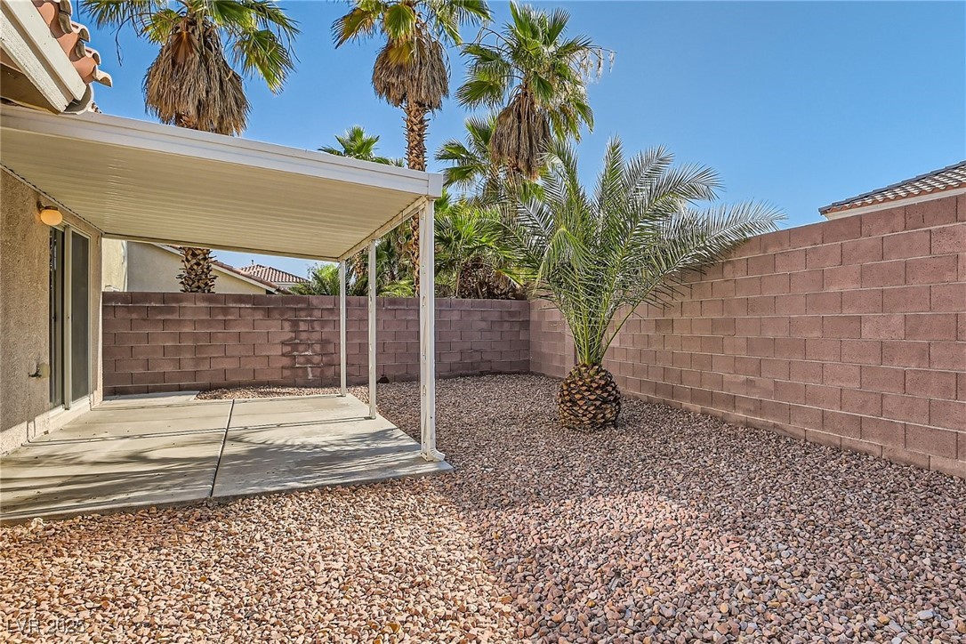 7550 Slipstream Street Las Vegas, NV 89139 - Photo 33 of 33 Fenced backyard featuring a patio area