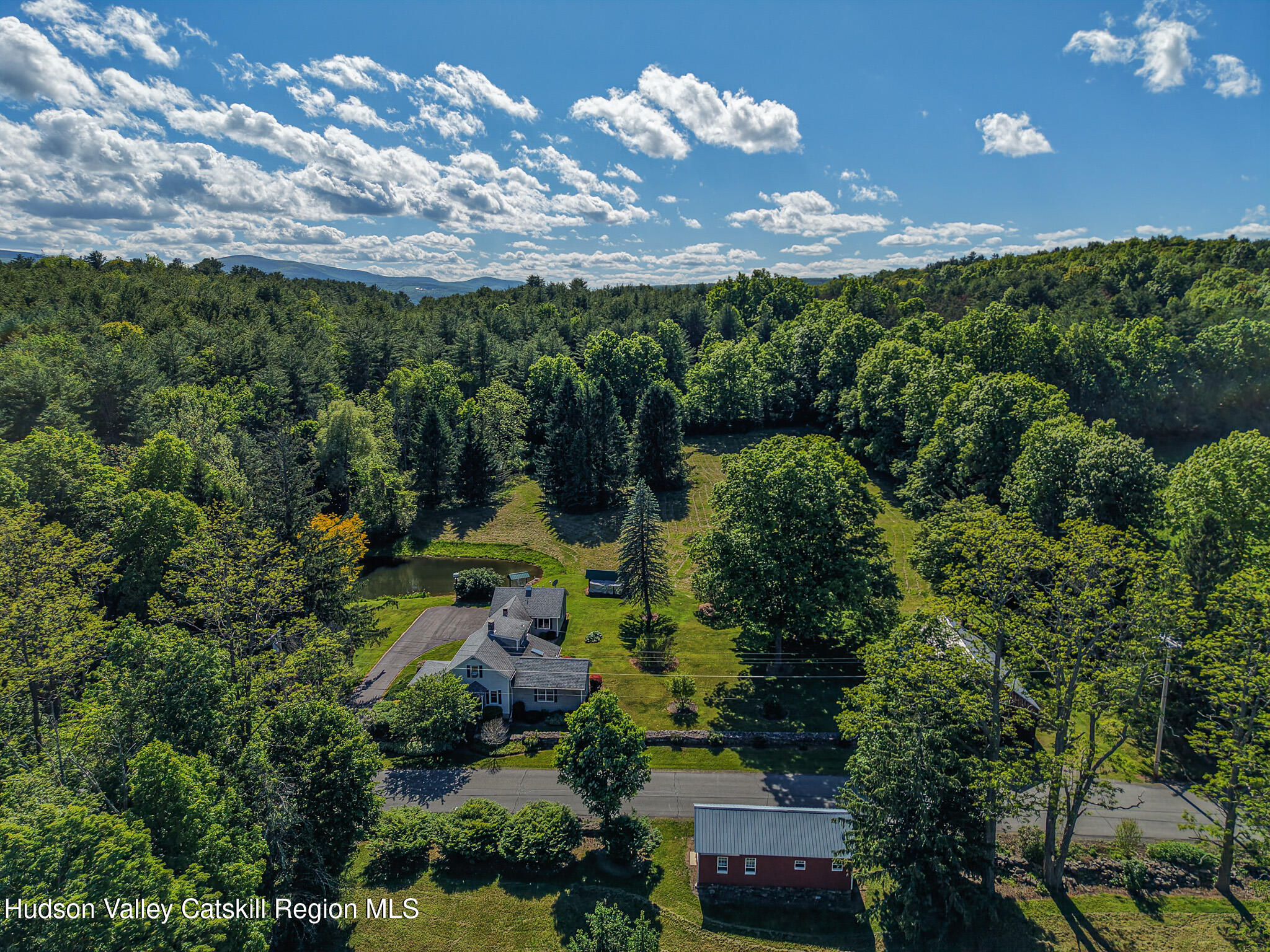 221 Camp Medusa Road Rensselaerville, NY 12120 - Photo 48 of 57 an aerial view of a house with lots of trees