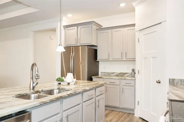 a kitchen with a sink and cabinets