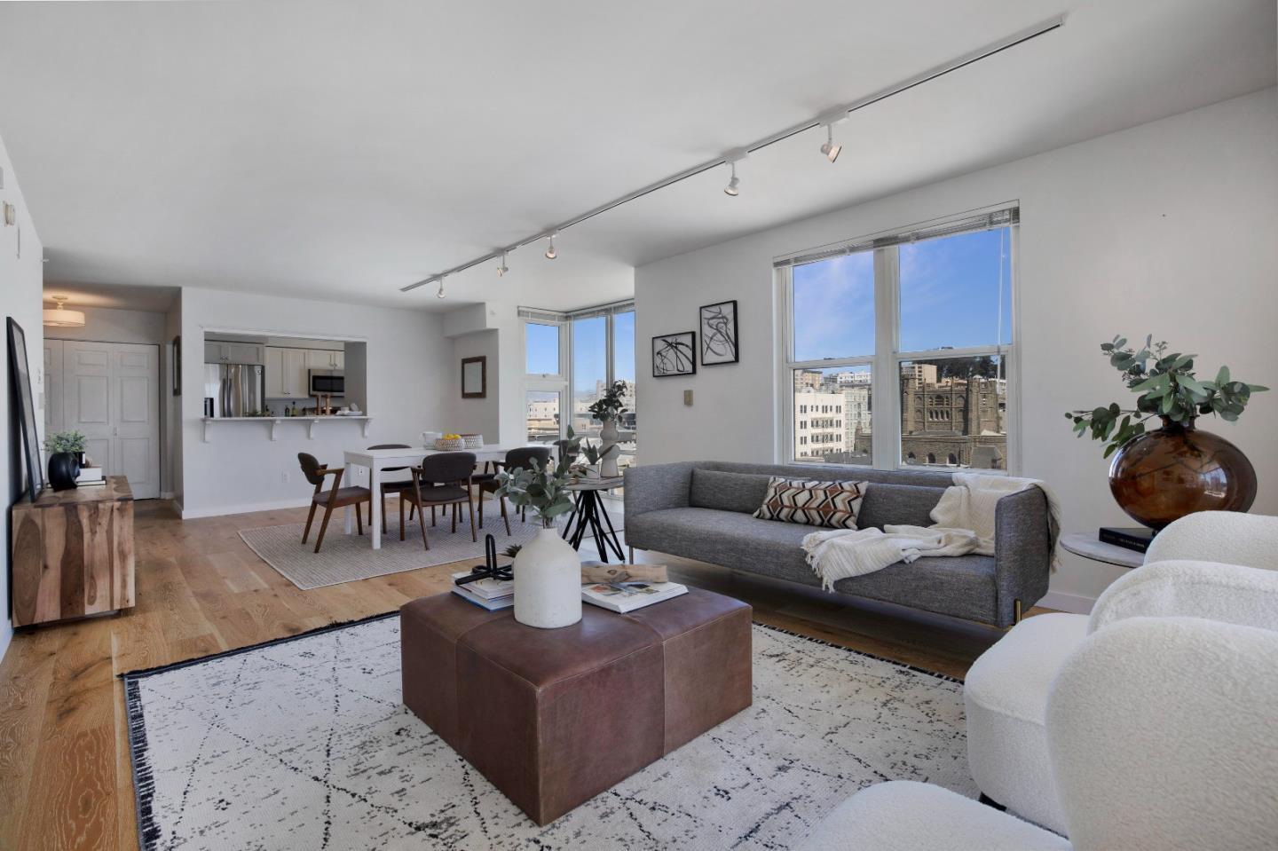 a living room with furniture potted plant and a window