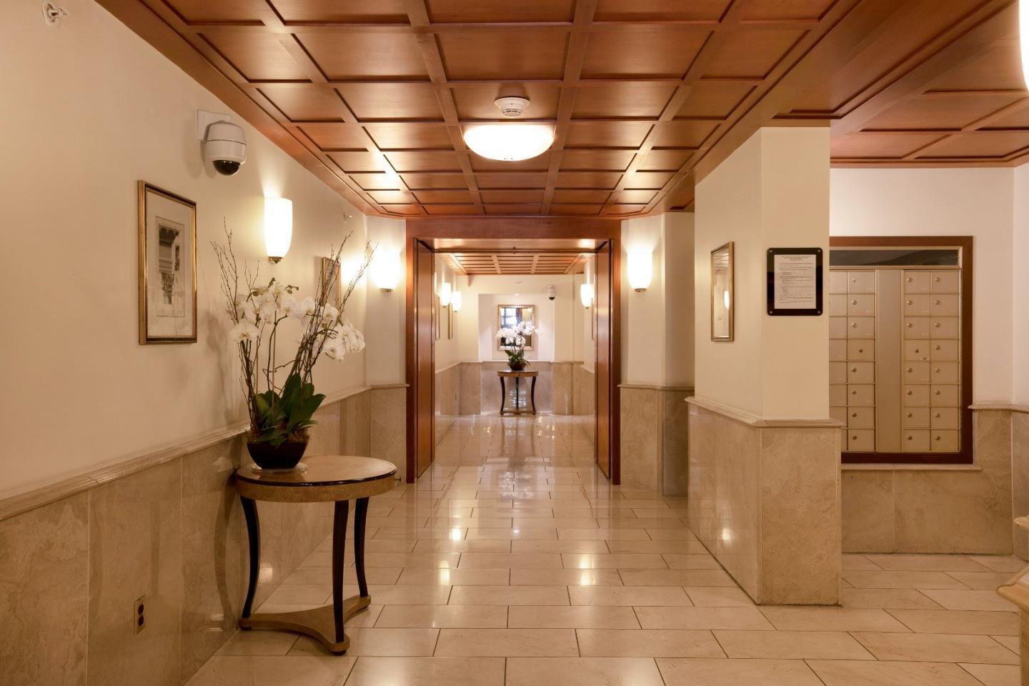 1483 Sutter Street, Unit 1101 San Francisco, CA 94109 - Photo 21 of 39 a view of a hallway with wooden shelves