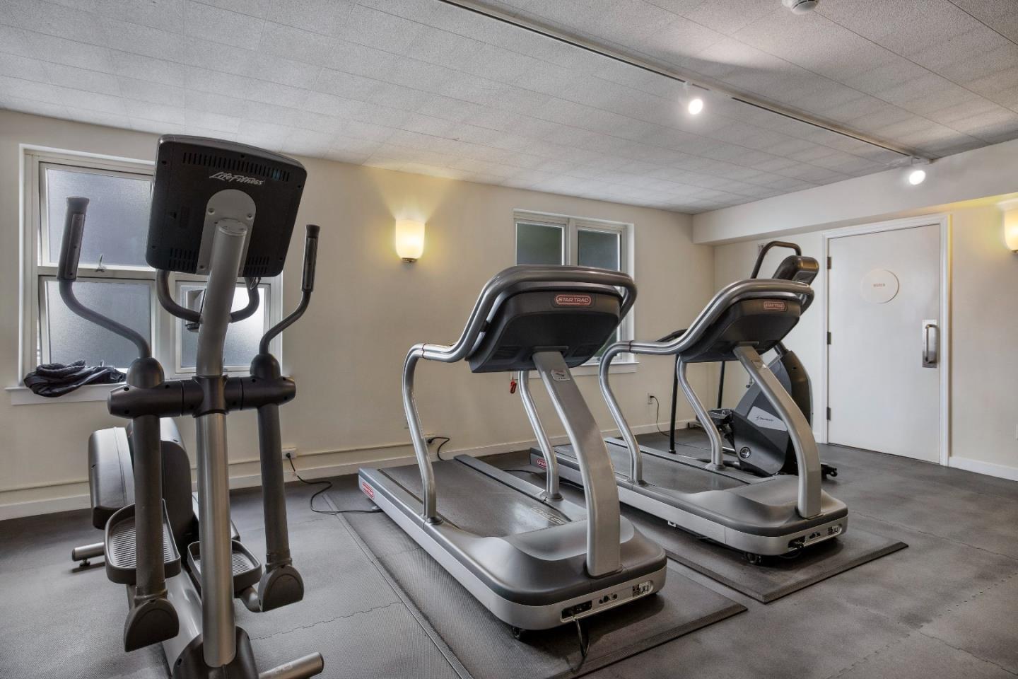 1483 Sutter Street, Unit 1101 San Francisco, CA 94109 - Photo 37 of 39 a room with gym equipment and windows