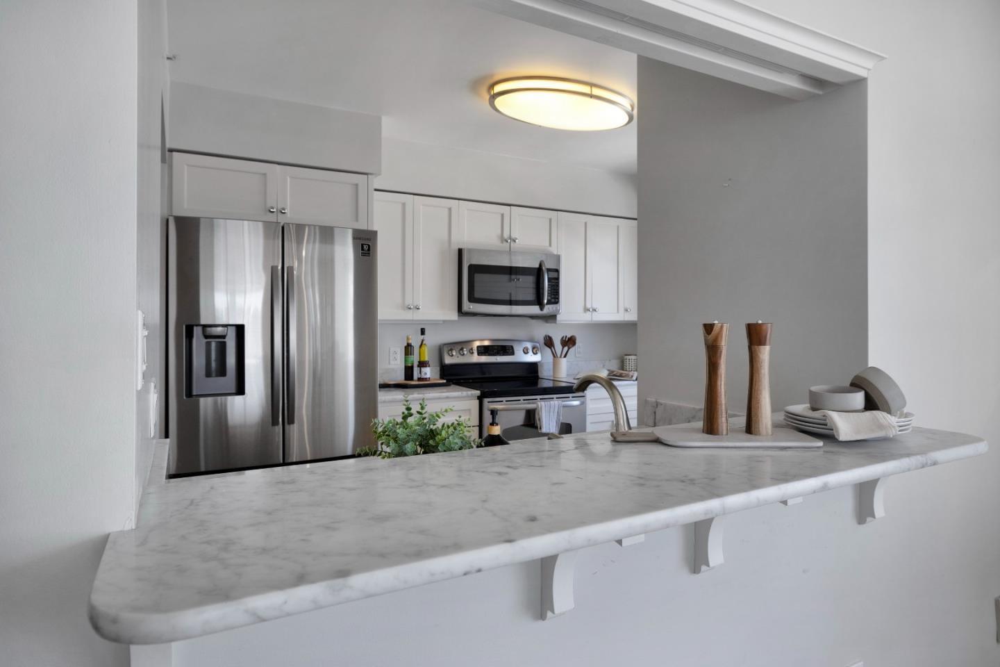 1483 Sutter Street, Unit 1101 San Francisco, CA 94109 - Photo 10 of 39 a kitchen with a refrigerator and a sink