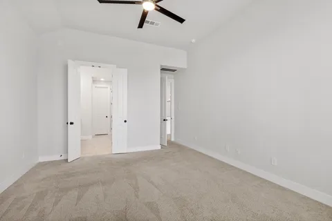 an empty room with fan