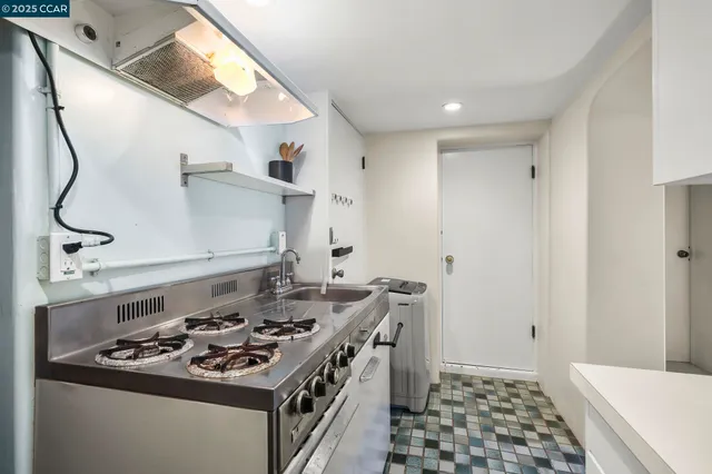a bathroom with a granite countertop sink toilet a mirror and shower
