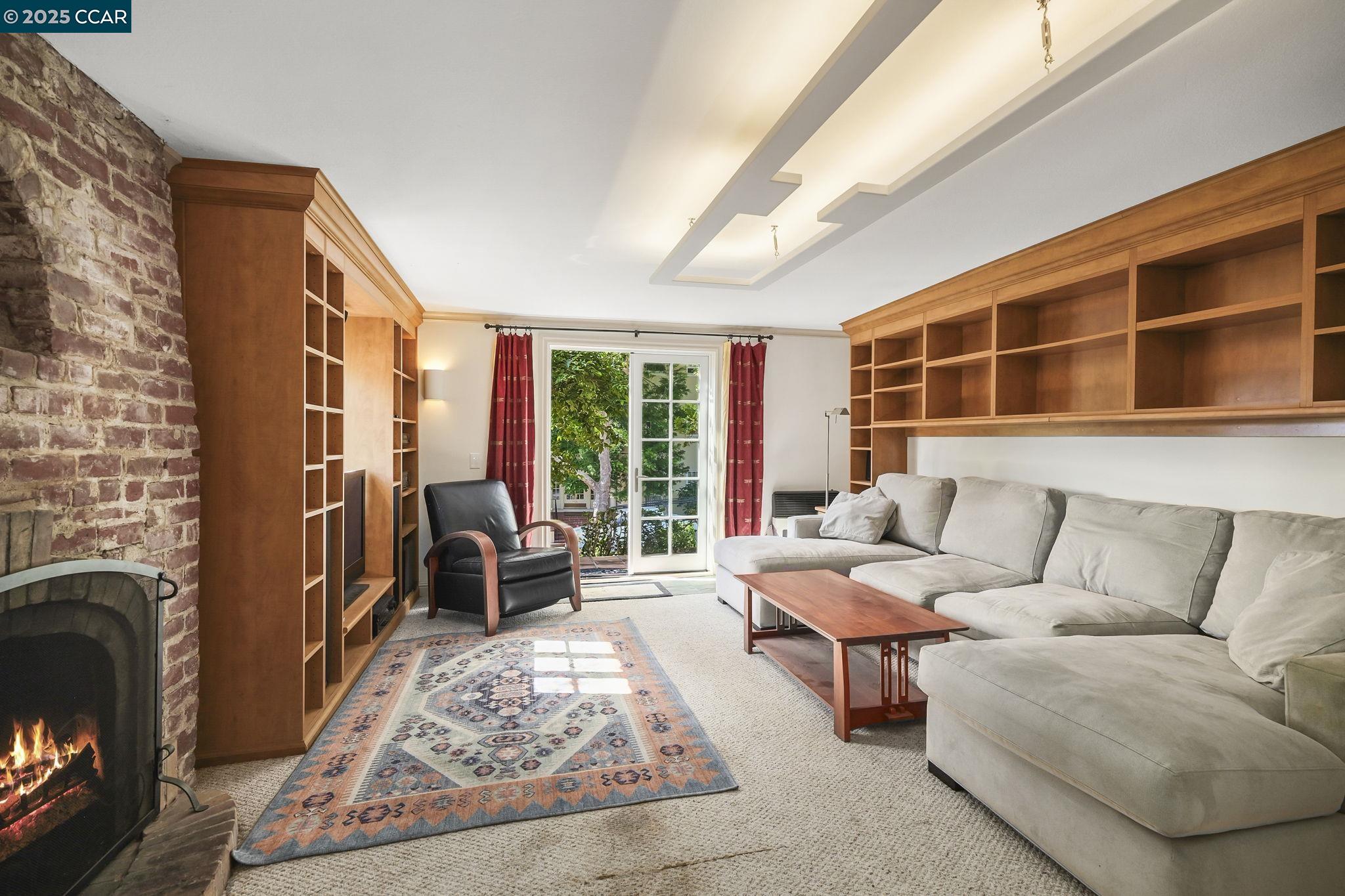 1407 Euclid Avenue Berkeley, CA 94708 - Photo 6 of 16 a living room with furniture and a fireplace