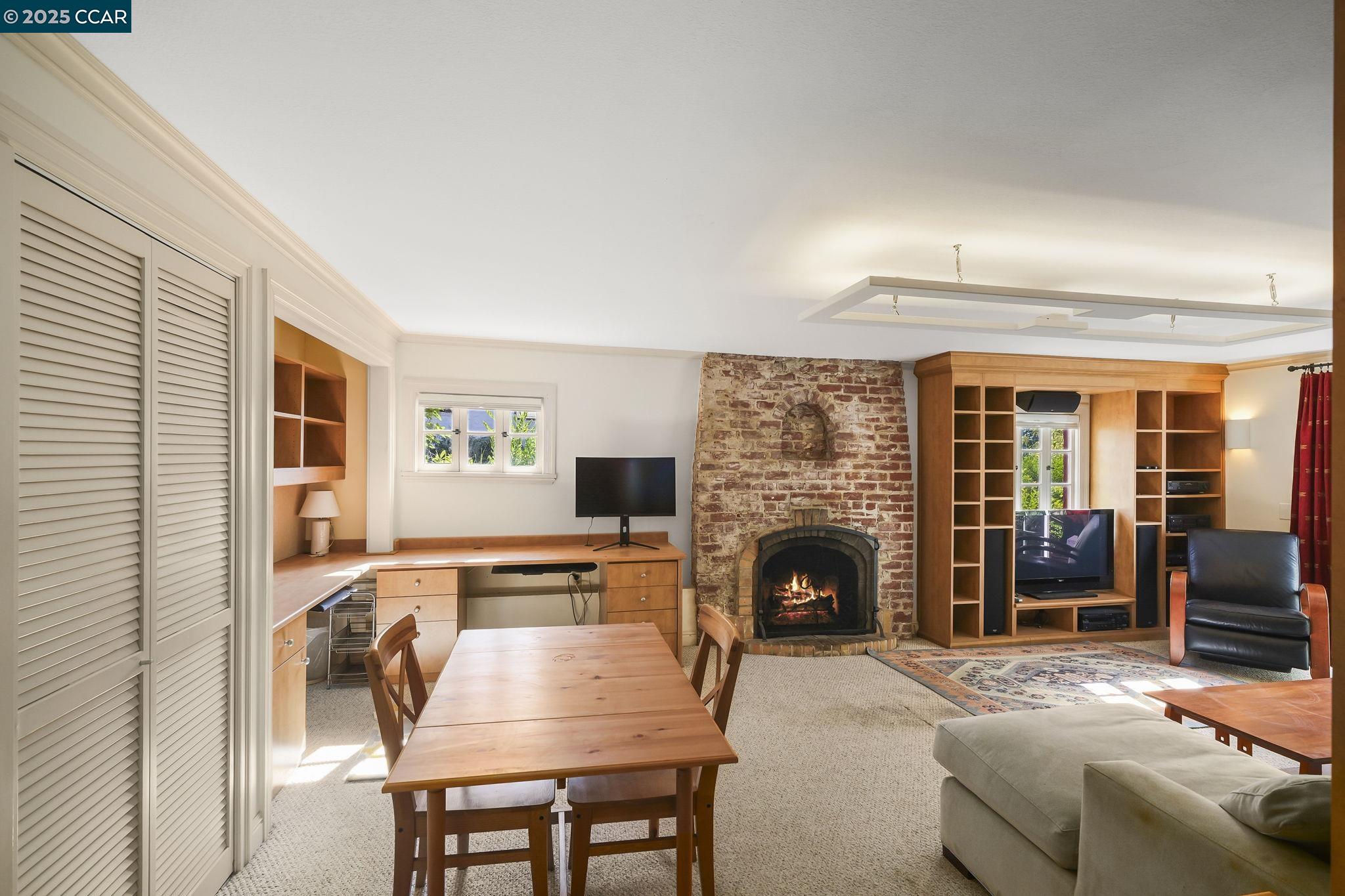 1407 Euclid Avenue Berkeley, CA 94708 - Photo 8 of 16 a living room with furniture and a fireplace