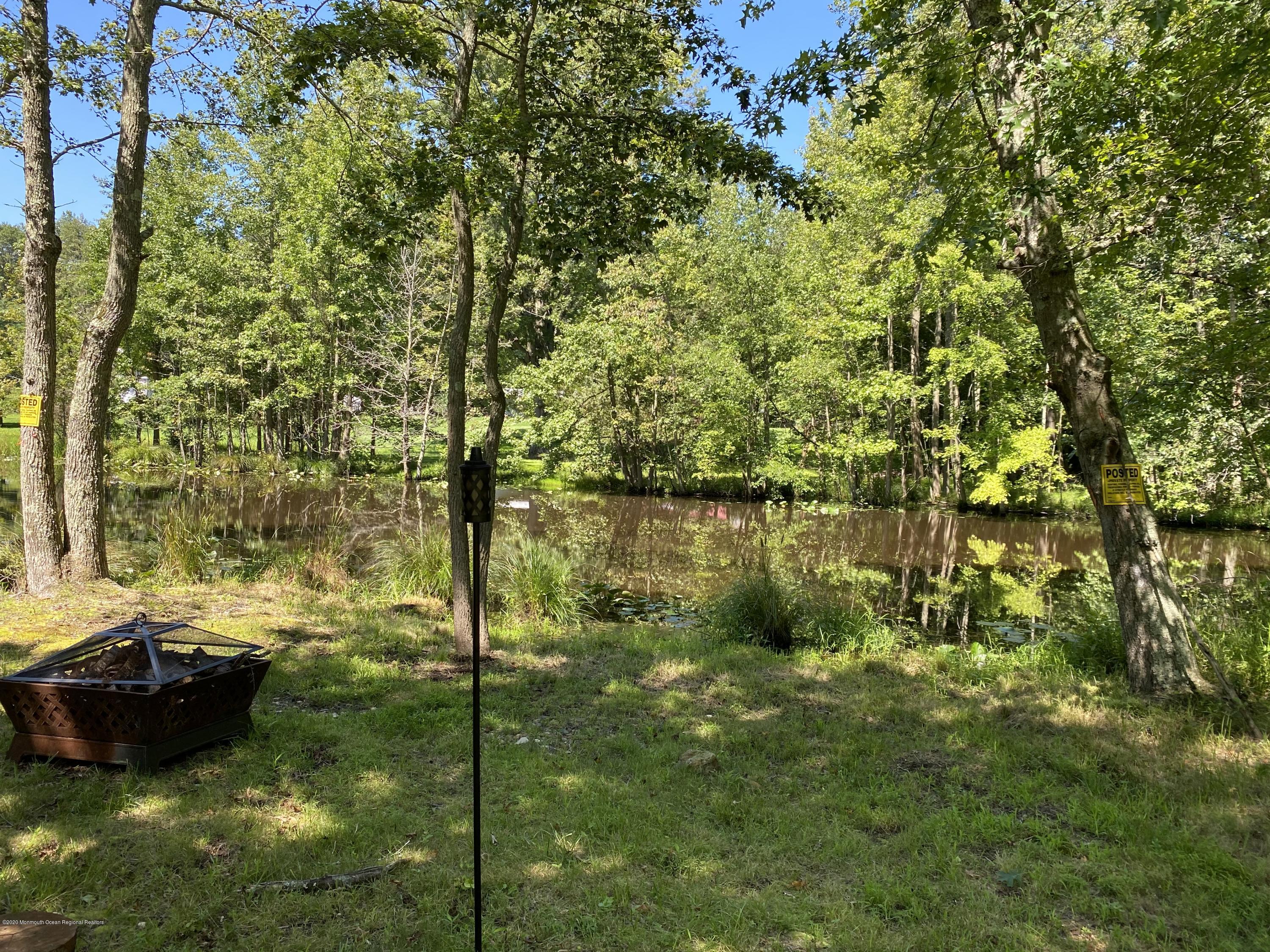 436 Stagecoach Road Millstone Township, NJ 08510 - Photo 16 of 97 a backyard of a house with lots of green space
