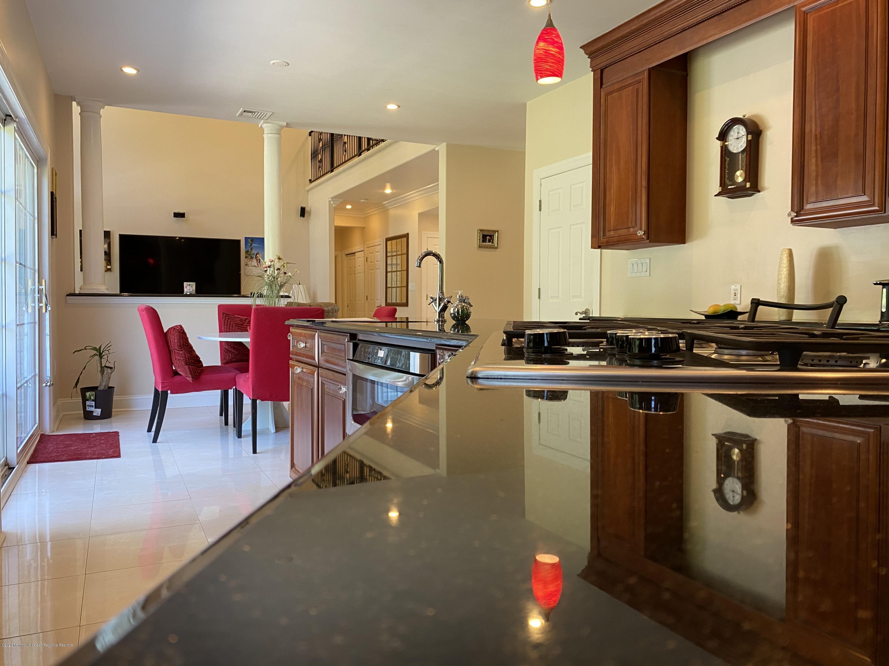 436 Stagecoach Road Millstone Township, NJ 08510 - Photo 34 of 97 a kitchen with stainless steel appliances kitchen island granite countertop a sink and cabinets