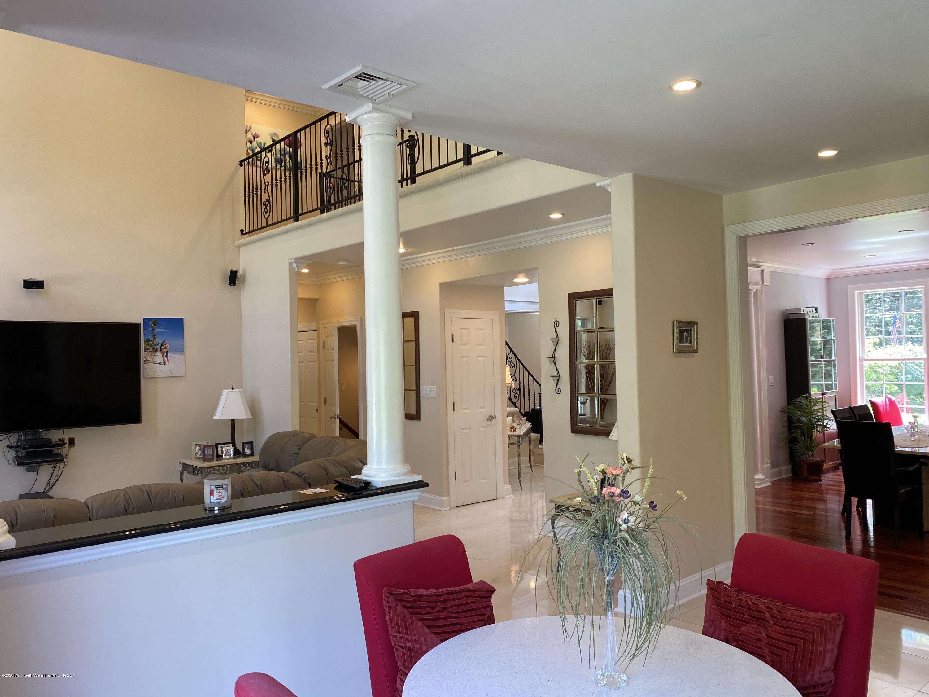 436 Stagecoach Road Millstone Township, NJ 08510 - Photo 37 of 97 a view of a livingroom with furniture and a flat screen tv