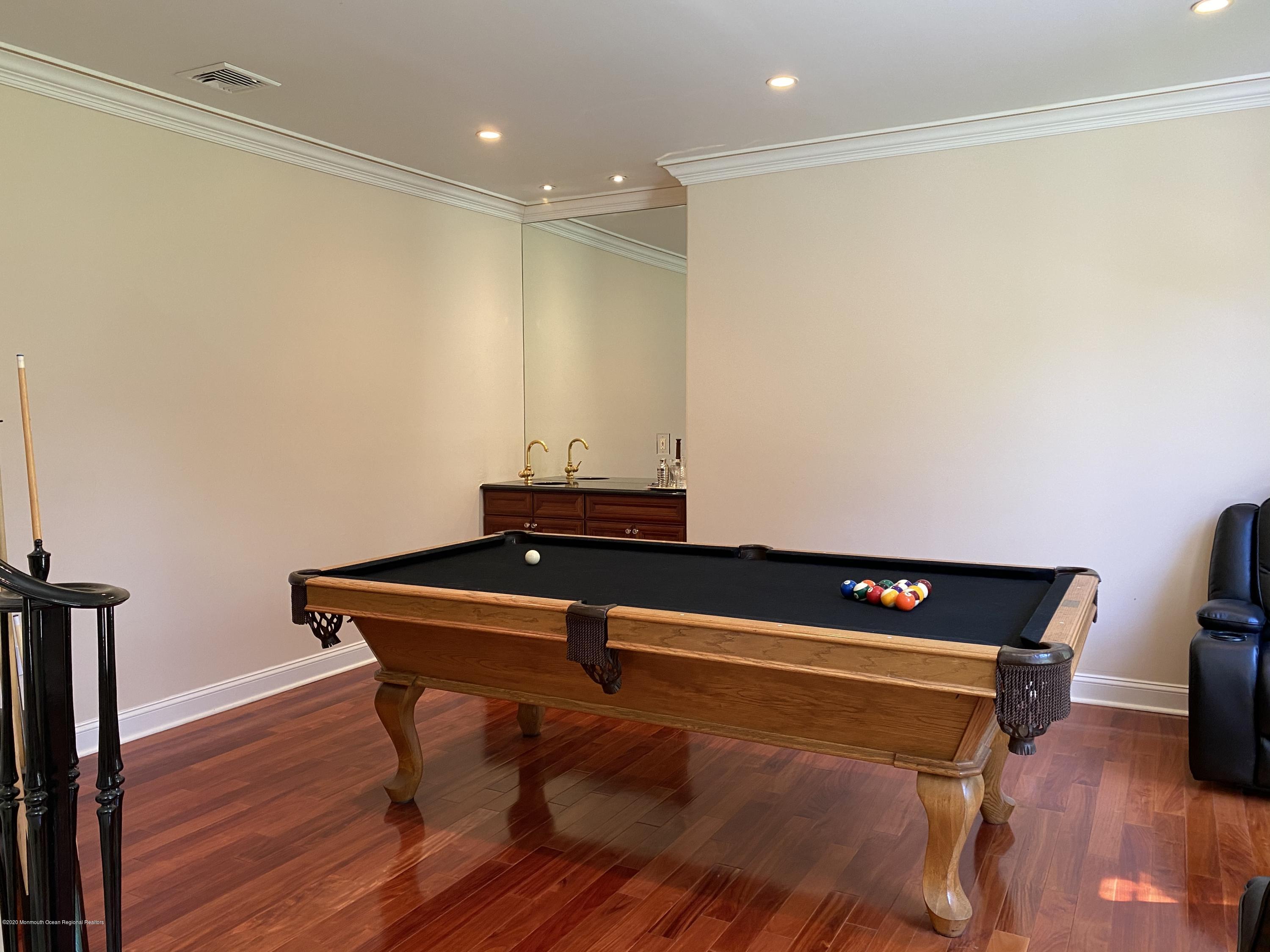 436 Stagecoach Road Millstone Township, NJ 08510 - Photo 41 of 97 a room with furniture and wooden floor