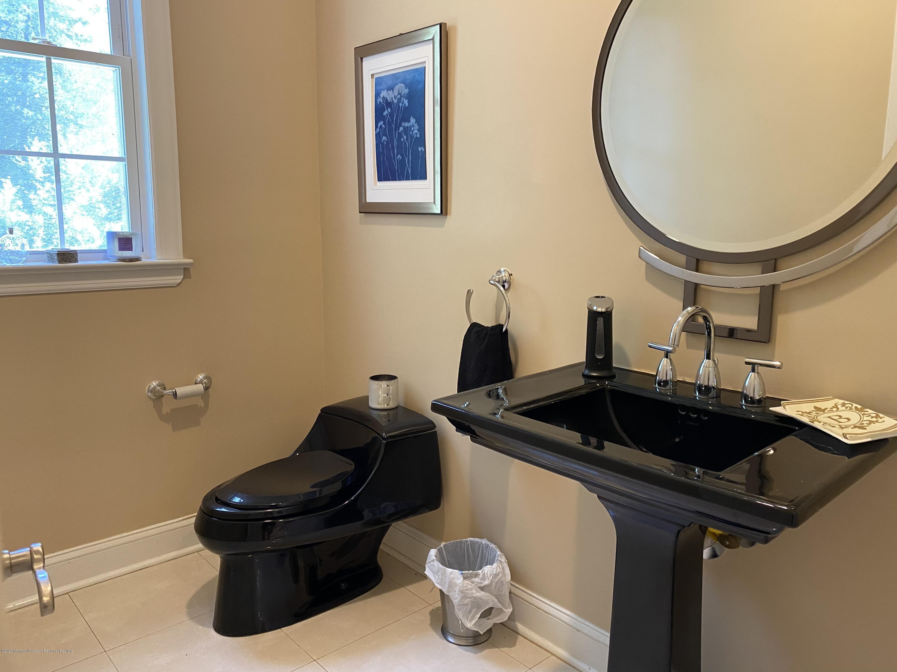 436 Stagecoach Road Millstone Township, NJ 08510 - Photo 43 of 97 a bathroom with a sink and a mirror