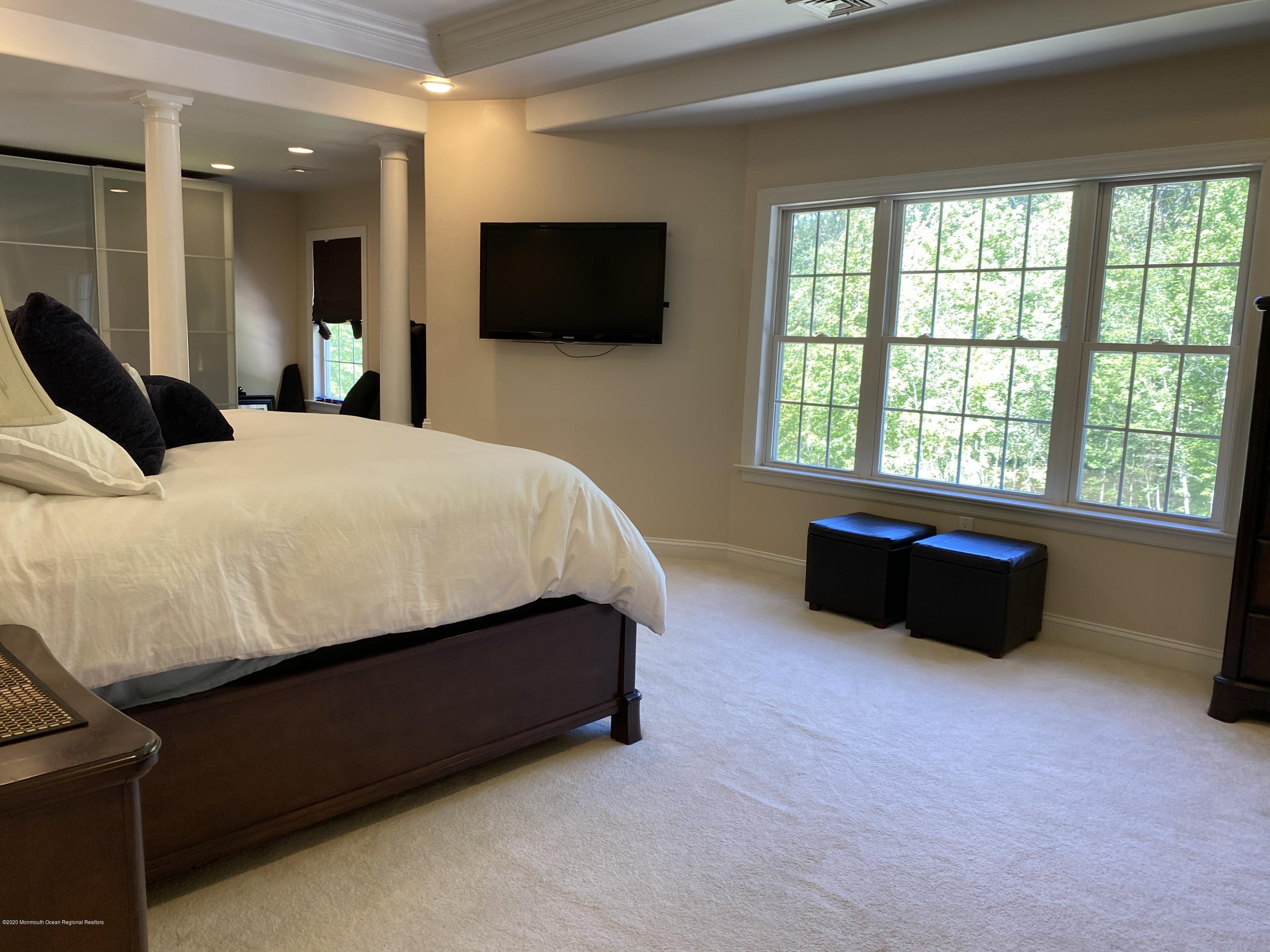 436 Stagecoach Road Millstone Township, NJ 08510 - Photo 48 of 97 a bed room with a bed and a television