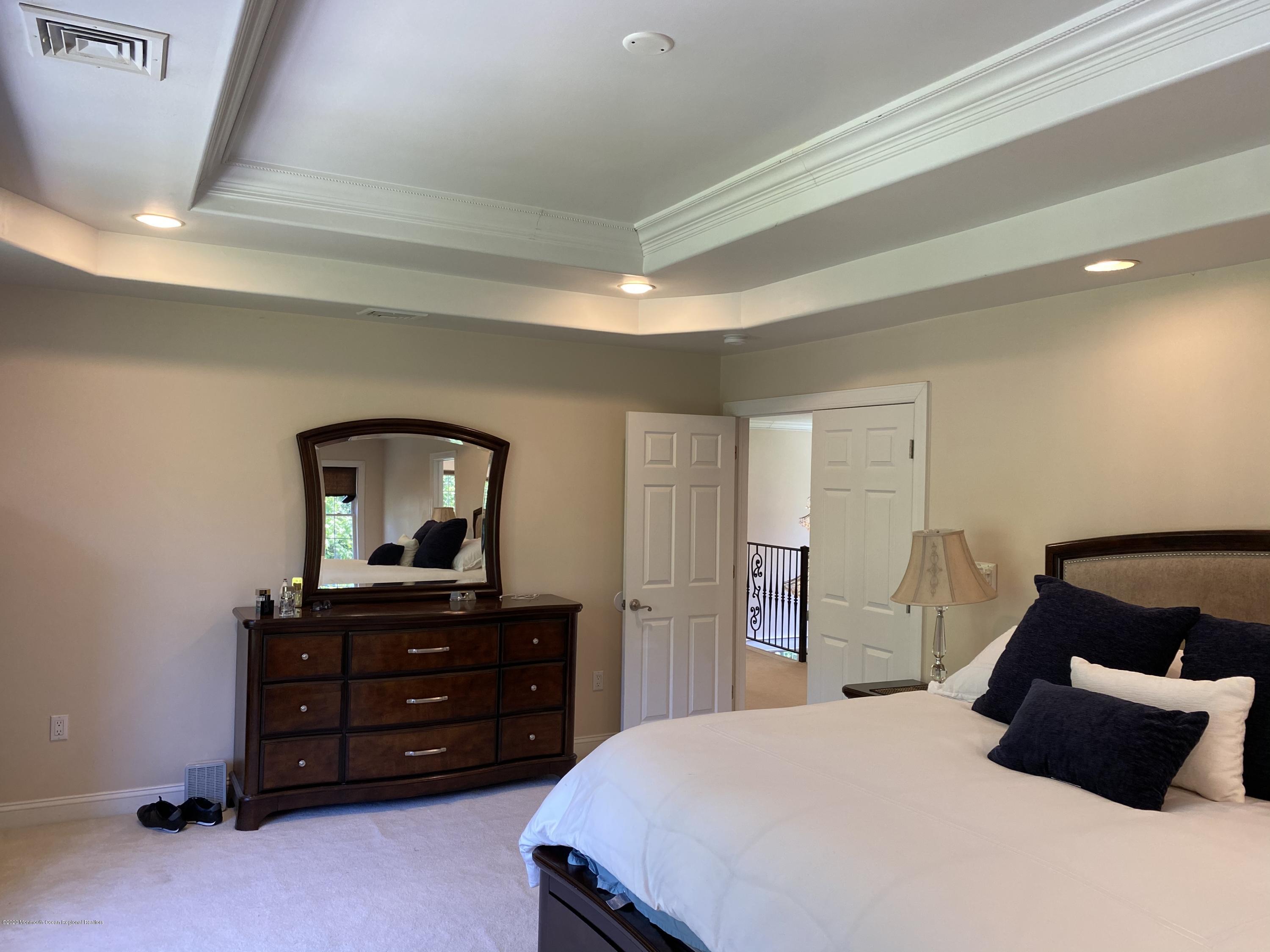 436 Stagecoach Road Millstone Township, NJ 08510 - Photo 53 of 97 a bedroom with a bed and a dresser