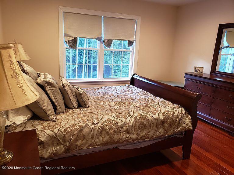 436 Stagecoach Road Millstone Township, NJ 08510 - Photo 59 of 97 a bed sitting in a bedroom next to a window