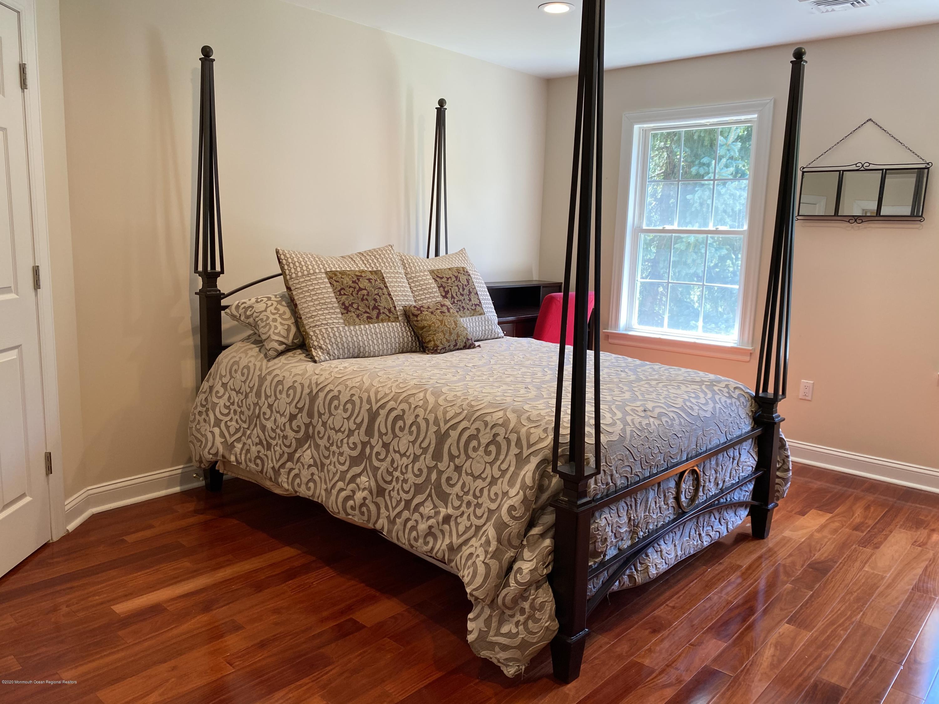 436 Stagecoach Road Millstone Township, NJ 08510 - Photo 60 of 97 a bedroom with a large bed and a window