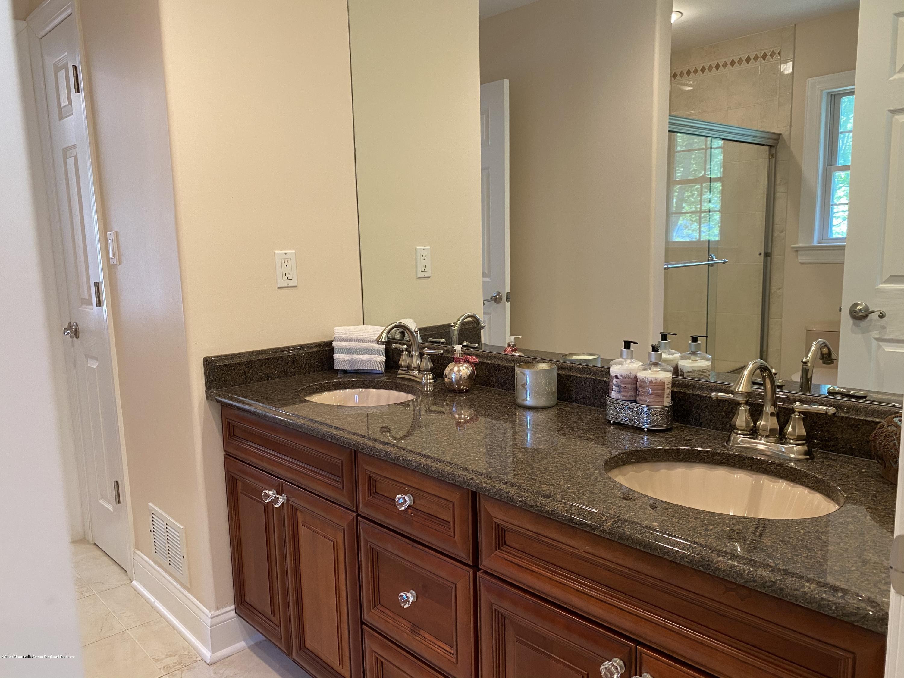 436 Stagecoach Road Millstone Township, NJ 08510 - Photo 62 of 97 a bathroom with double sink and a mirror