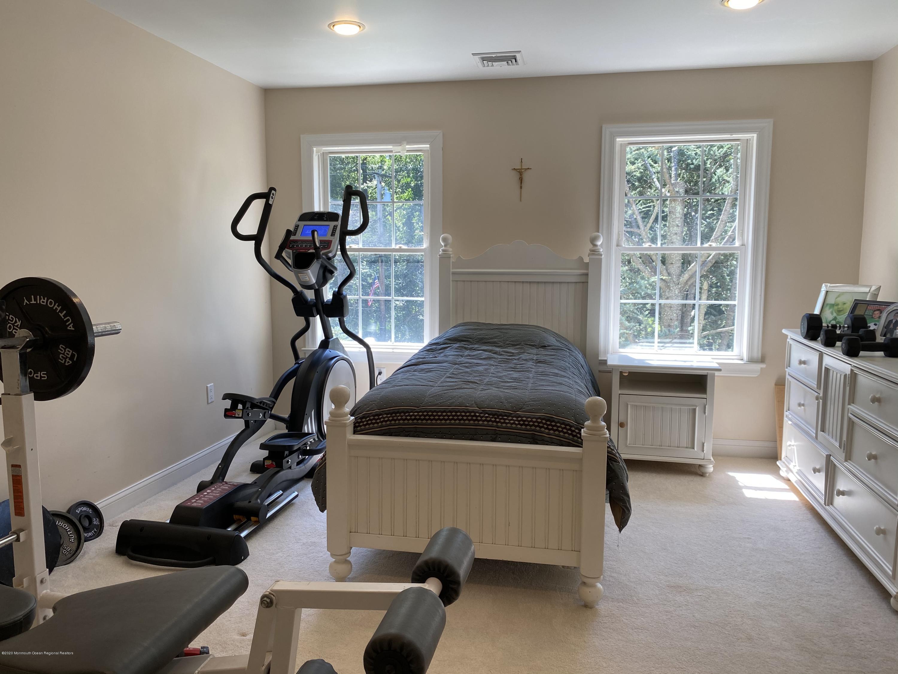 436 Stagecoach Road Millstone Township, NJ 08510 - Photo 64 of 97 a room with gym equipment and a window