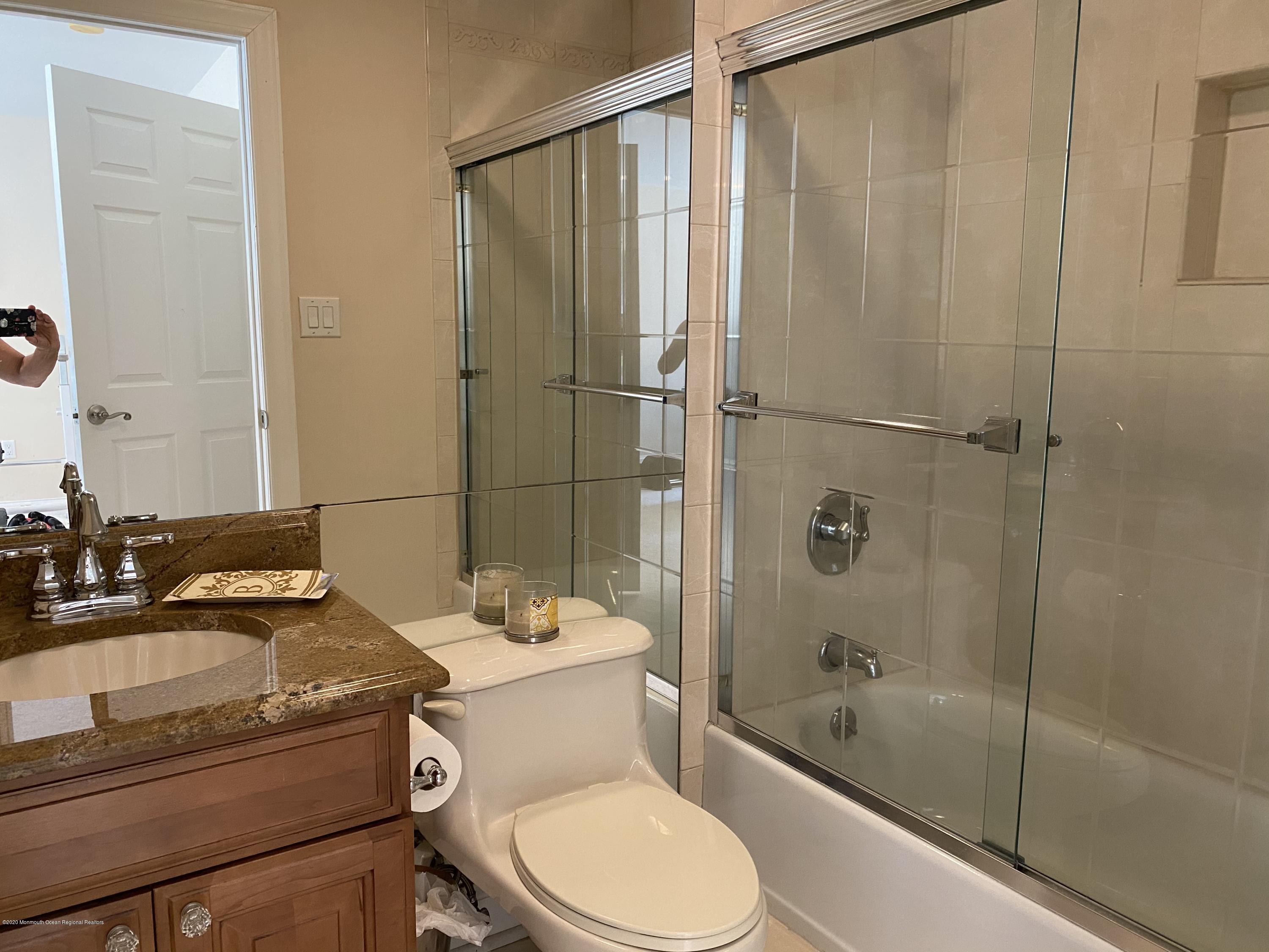 436 Stagecoach Road Millstone Township, NJ 08510 - Photo 65 of 97 a bathroom with a sink a toilet and shower