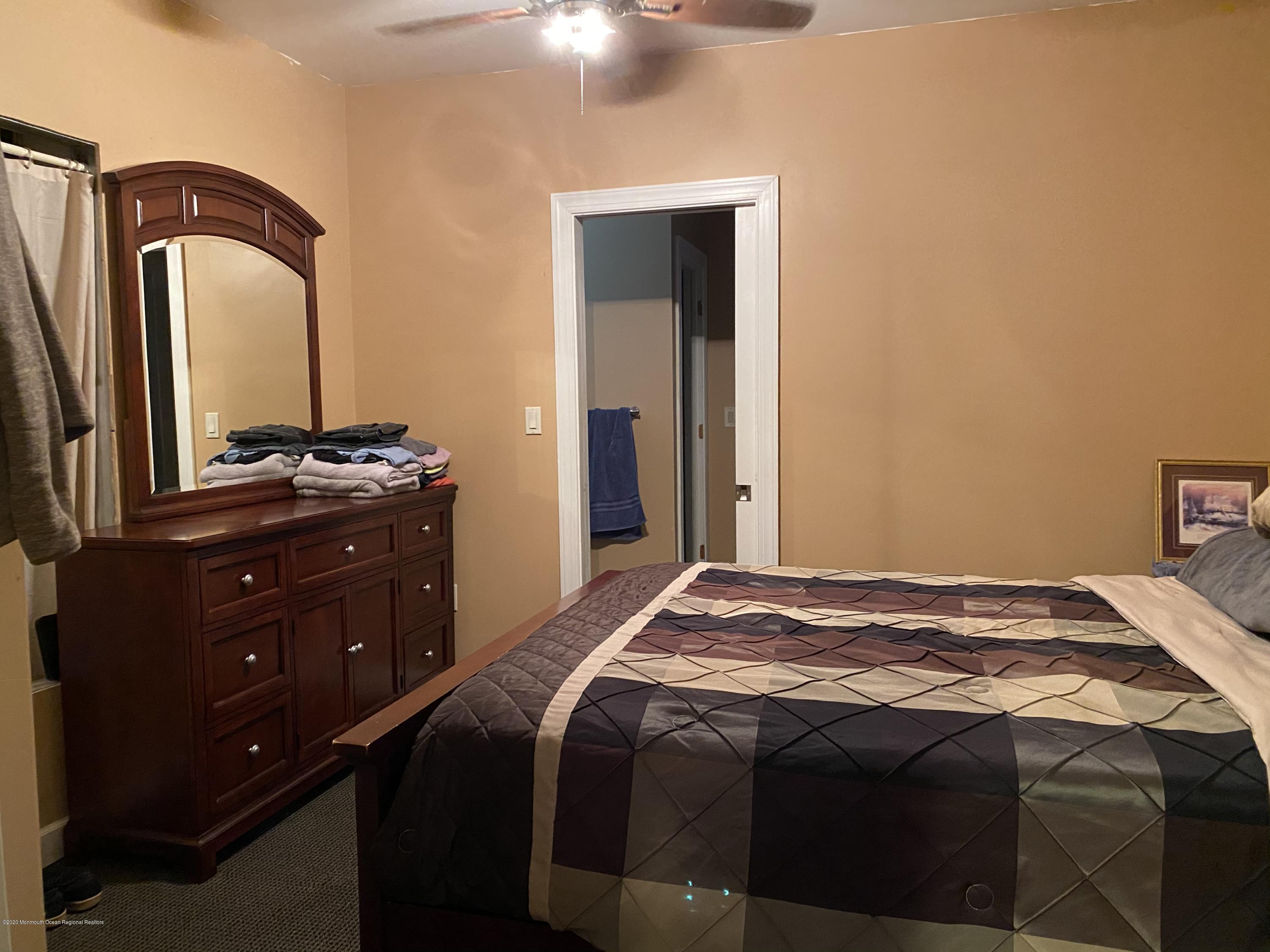 436 Stagecoach Road Millstone Township, NJ 08510 - Photo 70 of 97 a bedroom with a bed and a dresser