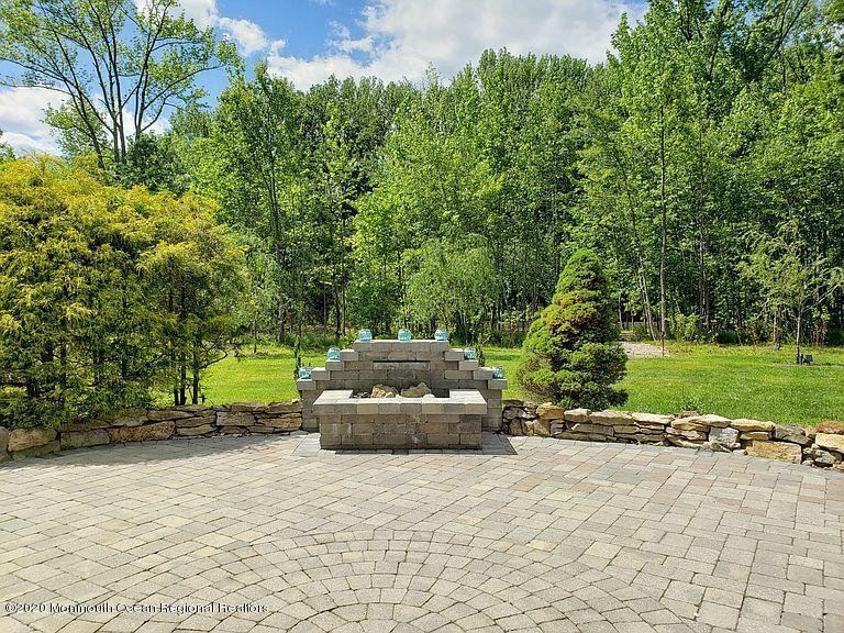 436 Stagecoach Road Millstone Township, NJ 08510 - Photo 84 of 97 a backyard of a house with lots of green space