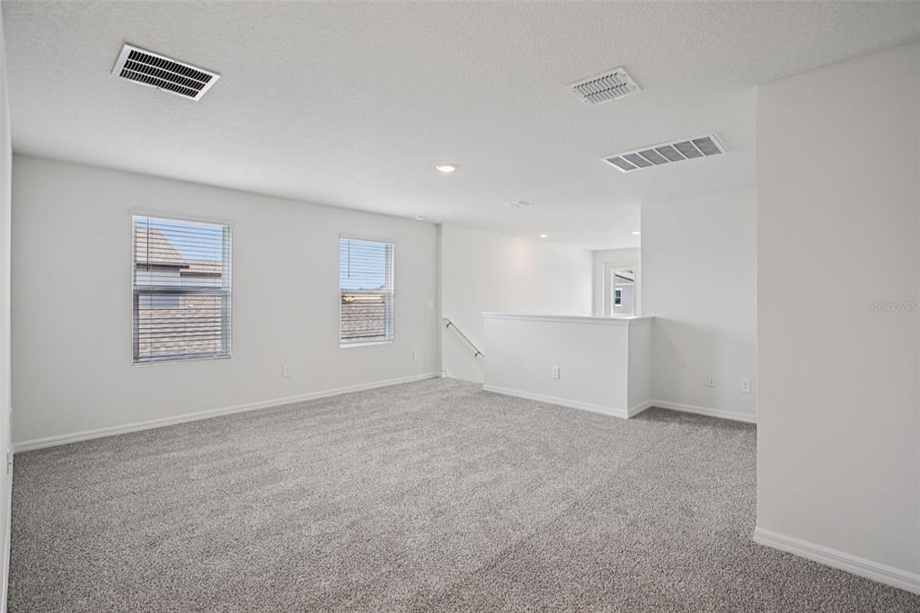 1820 Brekey Way Zephyrhills, FL 33541 - Photo 29 of 41 an empty room with windows