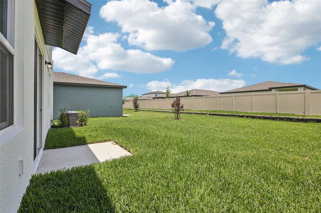 1820 Brekey Way Zephyrhills, FL 33541 - Photo 38 of 41 a front view of a house with garden