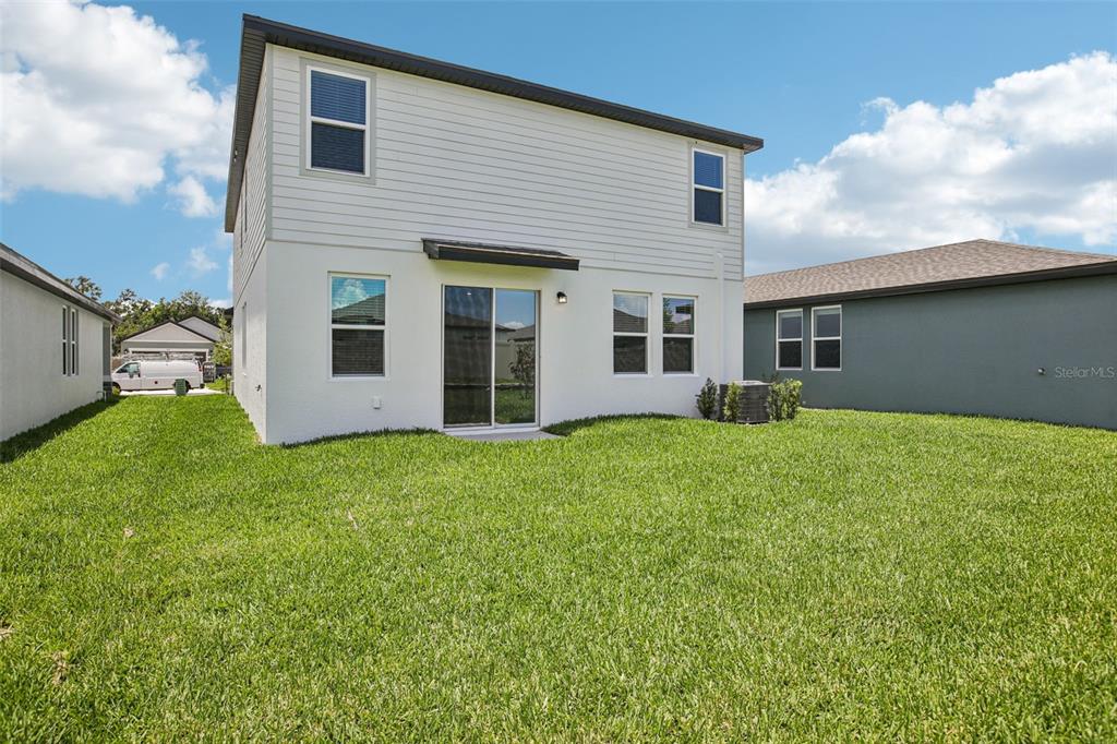 1820 Brekey Way Zephyrhills, FL 33541 - Photo 39 of 41 a house view with a garden space