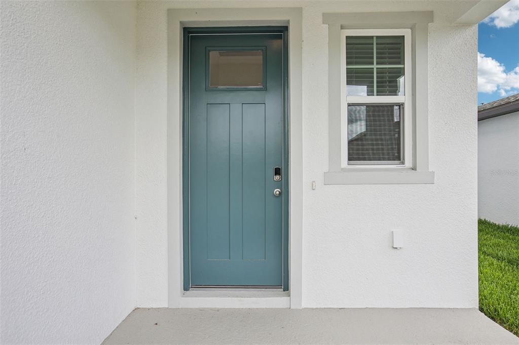 1820 Brekey Way Zephyrhills, FL 33541 - Photo 4 of 41 an entryway with wooden floor and windows