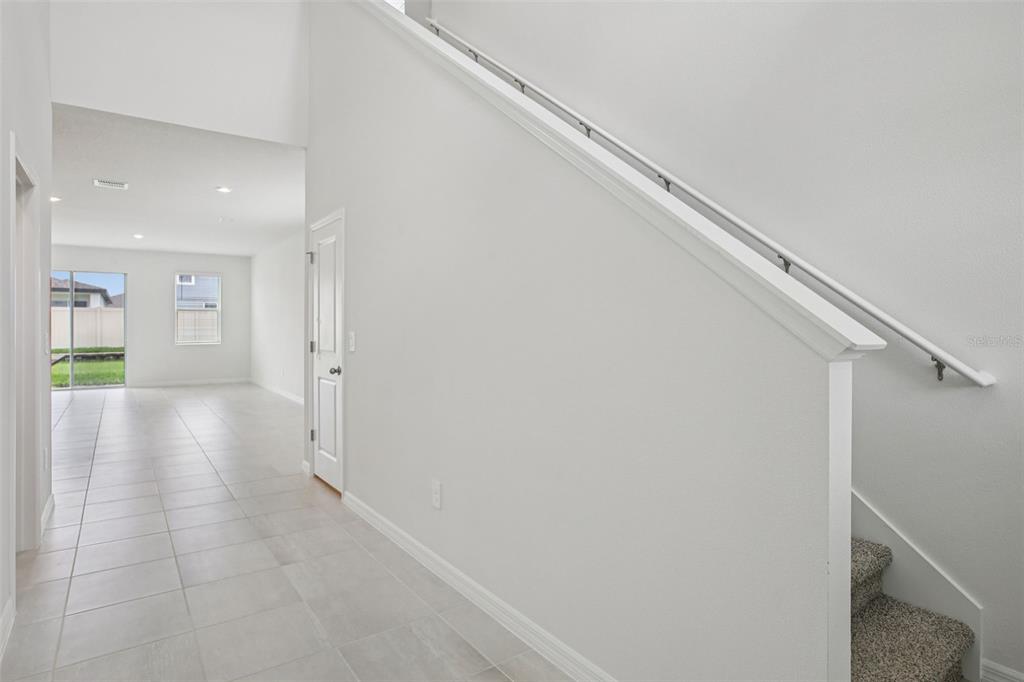 1820 Brekey Way Zephyrhills, FL 33541 - Photo 6 of 41 a view of a hallway with wooden floor
