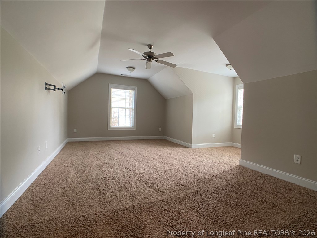 56 Orchard Falls Drive Spring Lake, NC 28390 - Photo 16 of 24 wooden floor in an empty room with a window